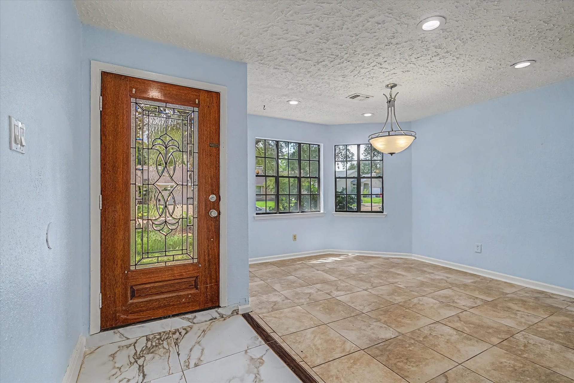 14218 Whitecross Drive, Houston, TX 77083 Formal dining room located at the front of the home, adjacent to the entryway.