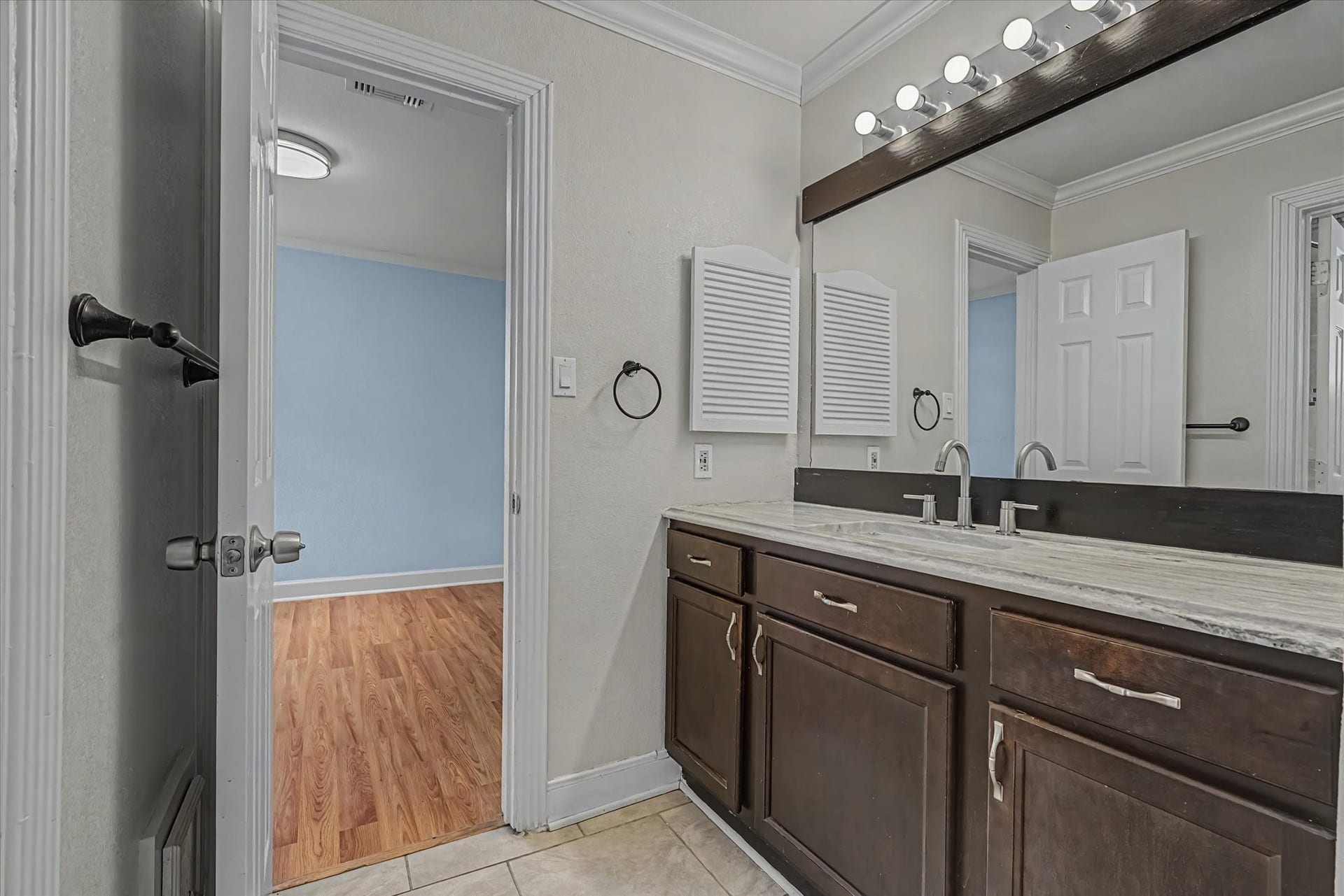 14218 Whitecross Drive, Houston, TX 77083 Secondary bathroom featuring ample storage space.