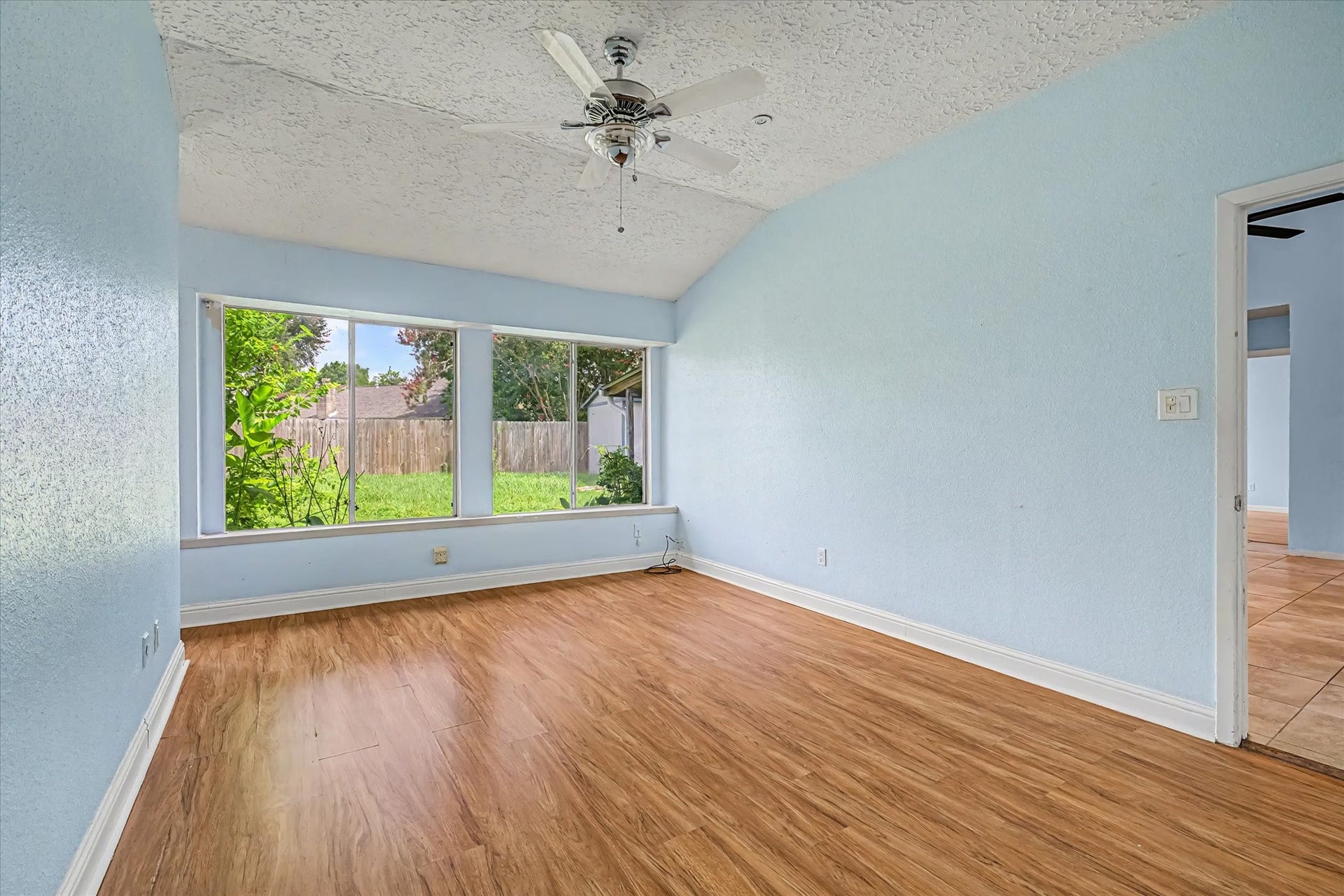 14218 Whitecross Drive, Houston, TX 77083 Expansive windows featuring a primary view of the gardens.