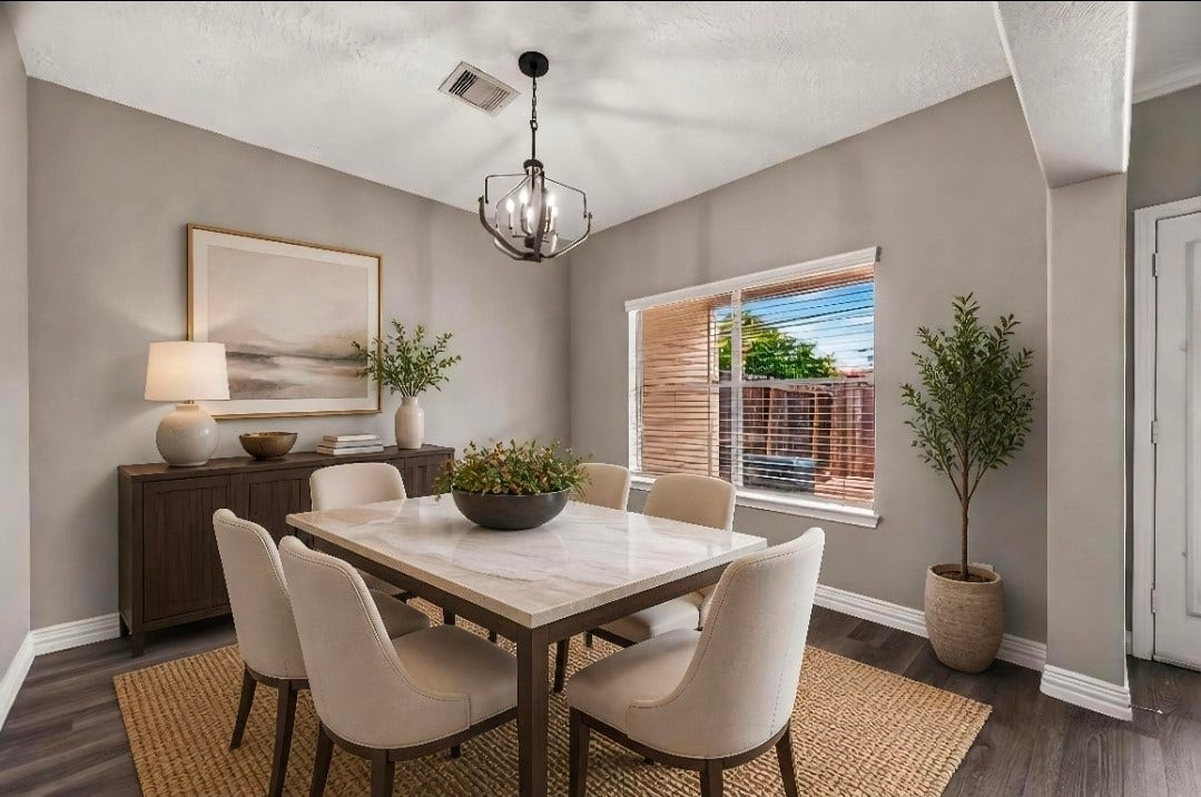 2034 Glencove Drive, Seabrook, TX 77586 Dining area with a statement chandelier and backyard views Virtually staged