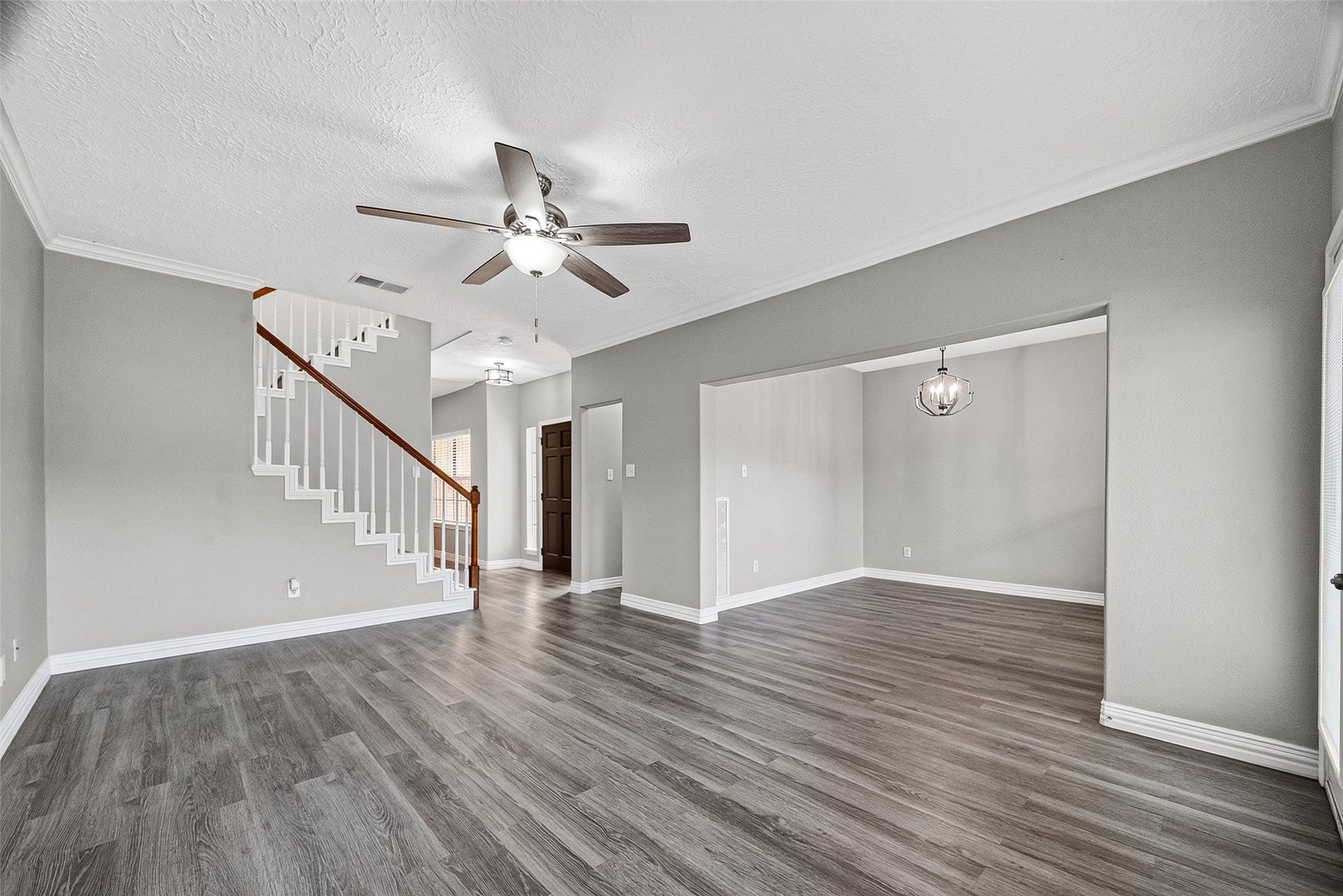 2034 Glencove Drive, Seabrook, TX 77586 Spacious living area with staircase and ceiling fan