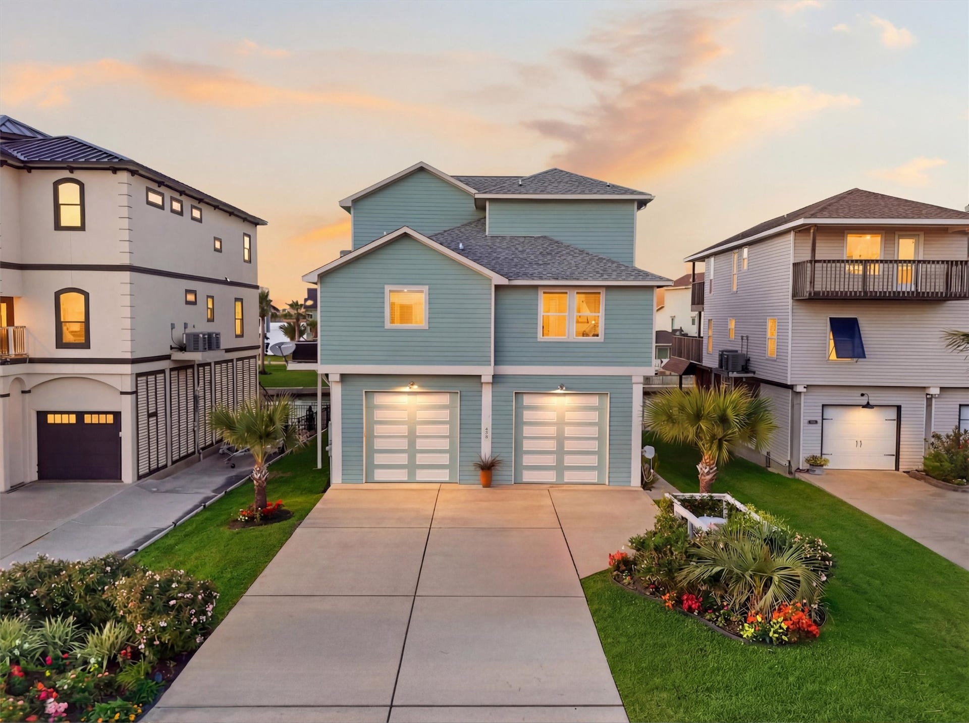 438 Amanda Circle, Tiki Island, TX 77554 Coastal charm shines from the
curb, where manicured
landscaping, timeless exterior
finishes, and a spacious
driveway create a warm and
polished first impression.
