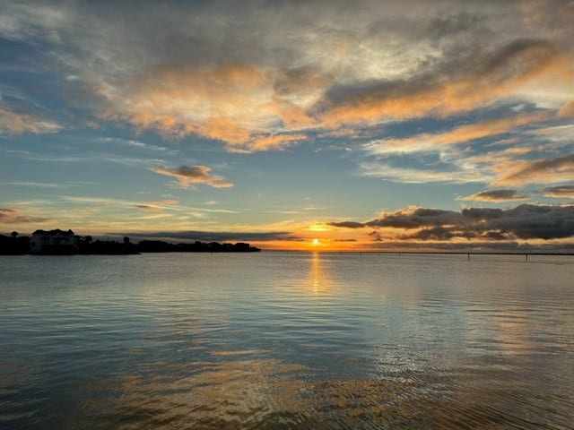 438 Amanda Circle, Tiki Island, TX 77554 Calm water, wide-open skies,
and glowing evening light create
the kind of peaceful coastal
backdrop that makes coming
home feel like a retreat.