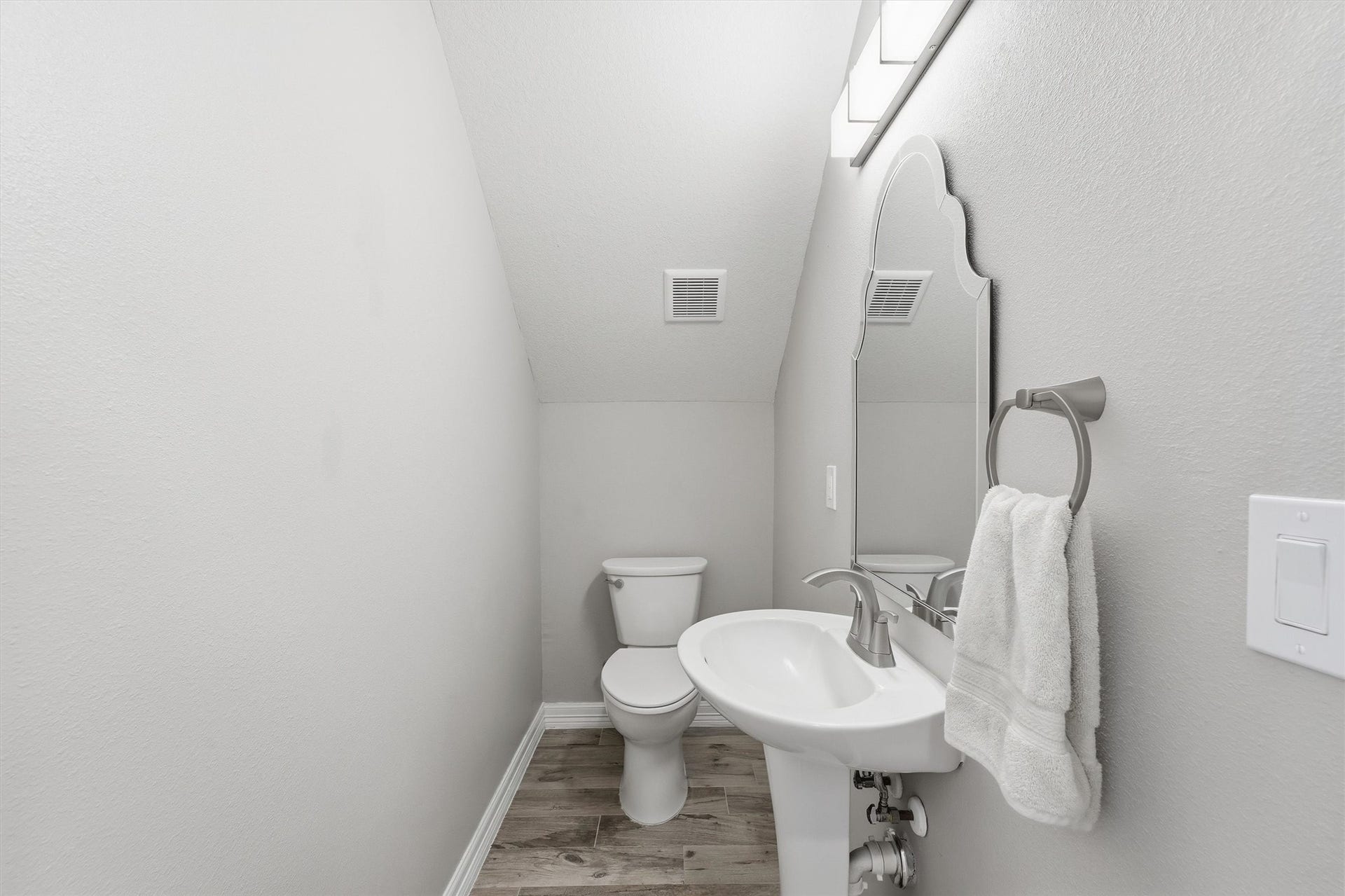 438 Amanda Circle, Tiki Island, TX 77554 Perfectly placed for guests, this
stylish powder bath adds
convenience to the main level
with a clean, modern look and
polished finishes.