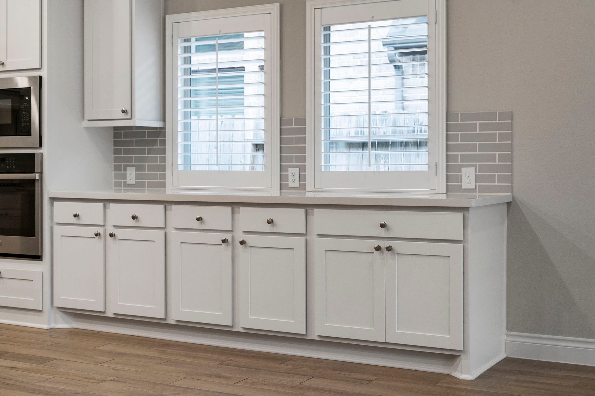 2315 Calm Channel Court, Missouri City, TX 77459 Built-in cabinetry and extra counter space in the dining area make entertaining easy, with plenty of room for serving and buffet-style dining.