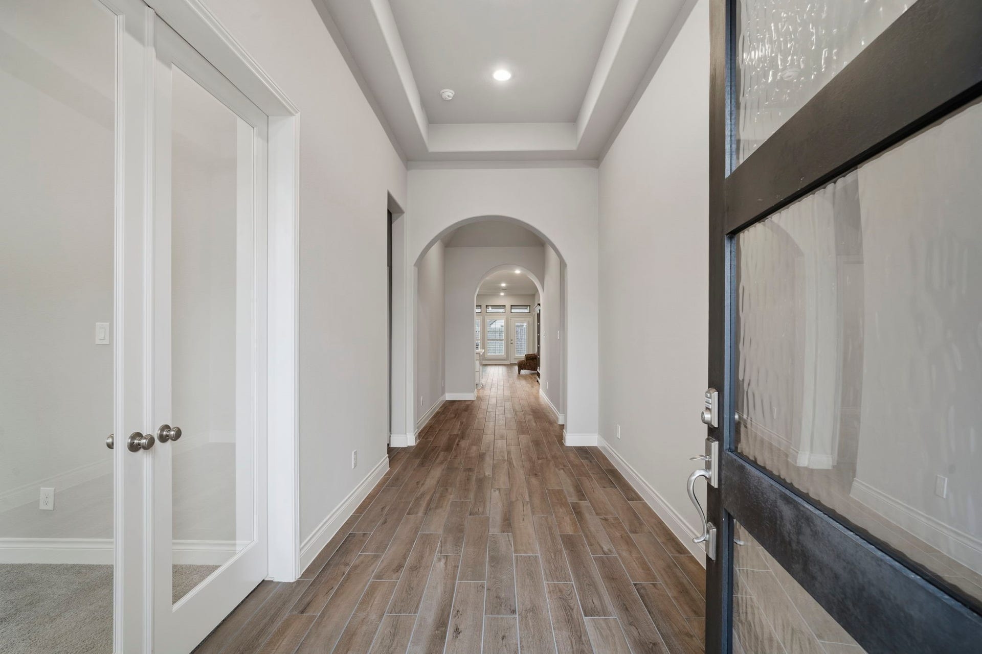 2315 Calm Channel Court, Missouri City, TX 77459 The spacious center hall showcases graceful arched entrances, adding architectural charm.
