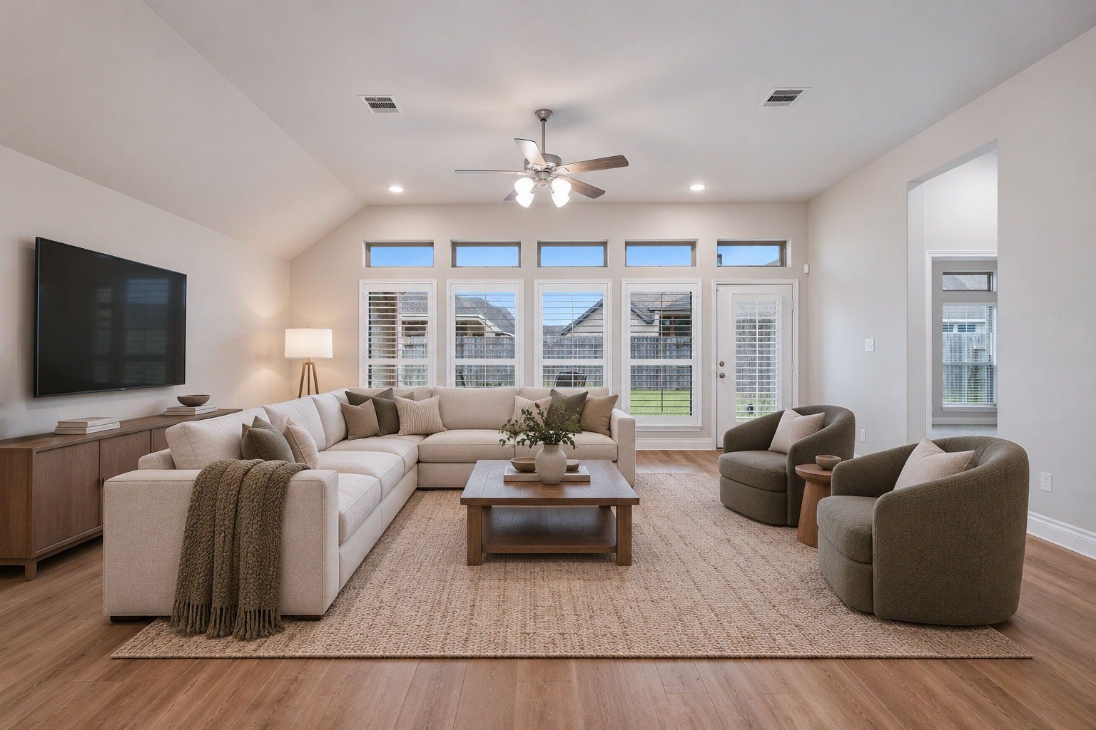 2315 Calm Channel Court, Missouri City, TX 77459 Beautiful wood plank tile flooring, neutral finishes, and high ceilings create a light, airy atmosphere that complements any dcor. Digitally staged.
