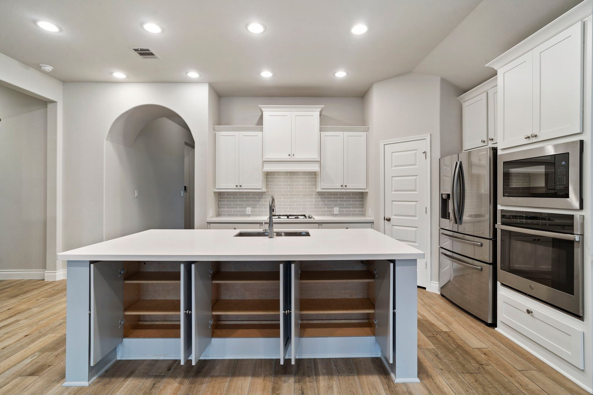2315 Calm Channel Court, Missouri City, TX 77459 Keep kitchen essentials organized and within easy reach with accessible island storage on both sides.