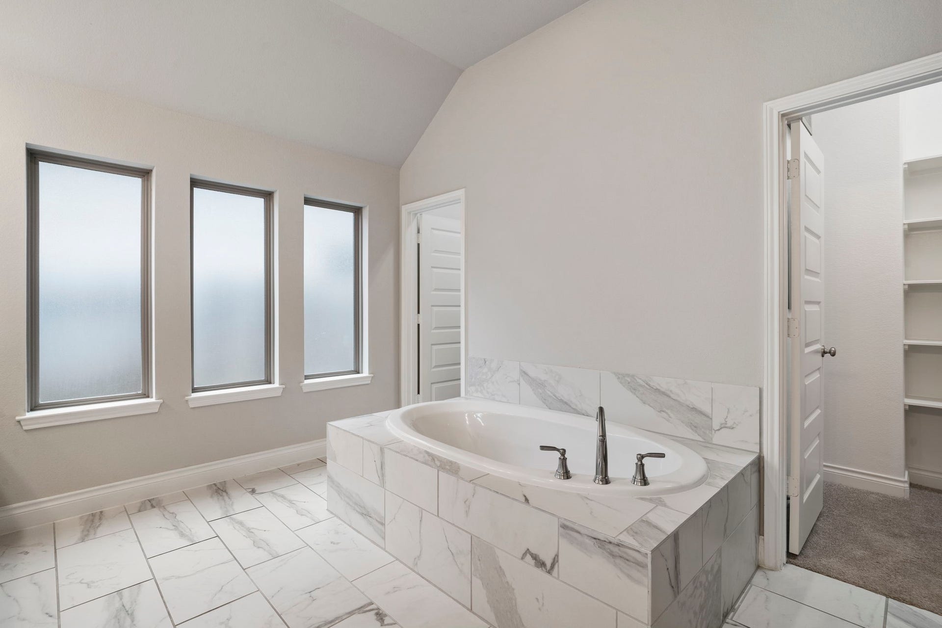 2315 Calm Channel Court, Missouri City, TX 77459 Privacy windows fill the owners bath with soft natural light while maintaining a peaceful, secluded feel.