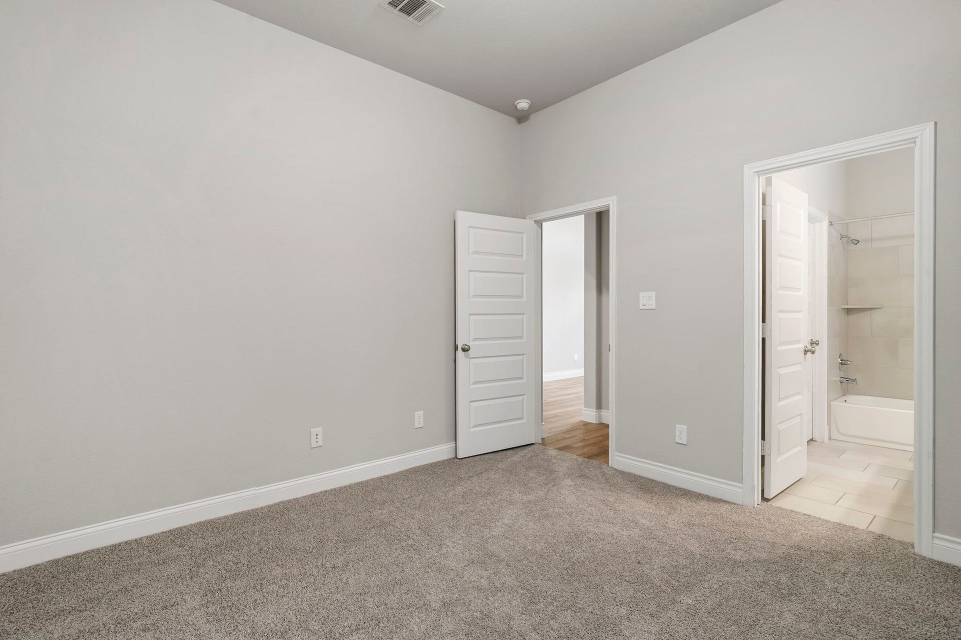 2315 Calm Channel Court, Missouri City, TX 77459 View toward the guest room entrance and the doorway to the en-suite bathroom.