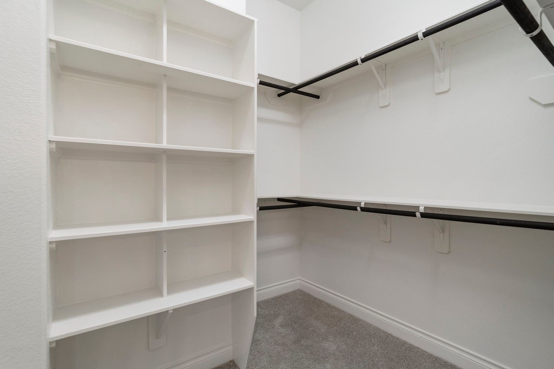 2315 Calm Channel Court, Missouri City, TX 77459 The owner's suite features TWO walk-in closets with hanging racks and built-in shelf storage.