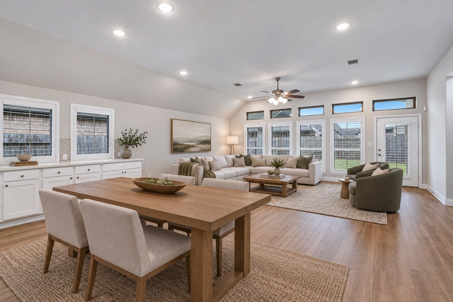 2315 Calm Channel Court, Missouri City, TX 77459 A wall of windows fills the family room with natural light. Digitally staged.