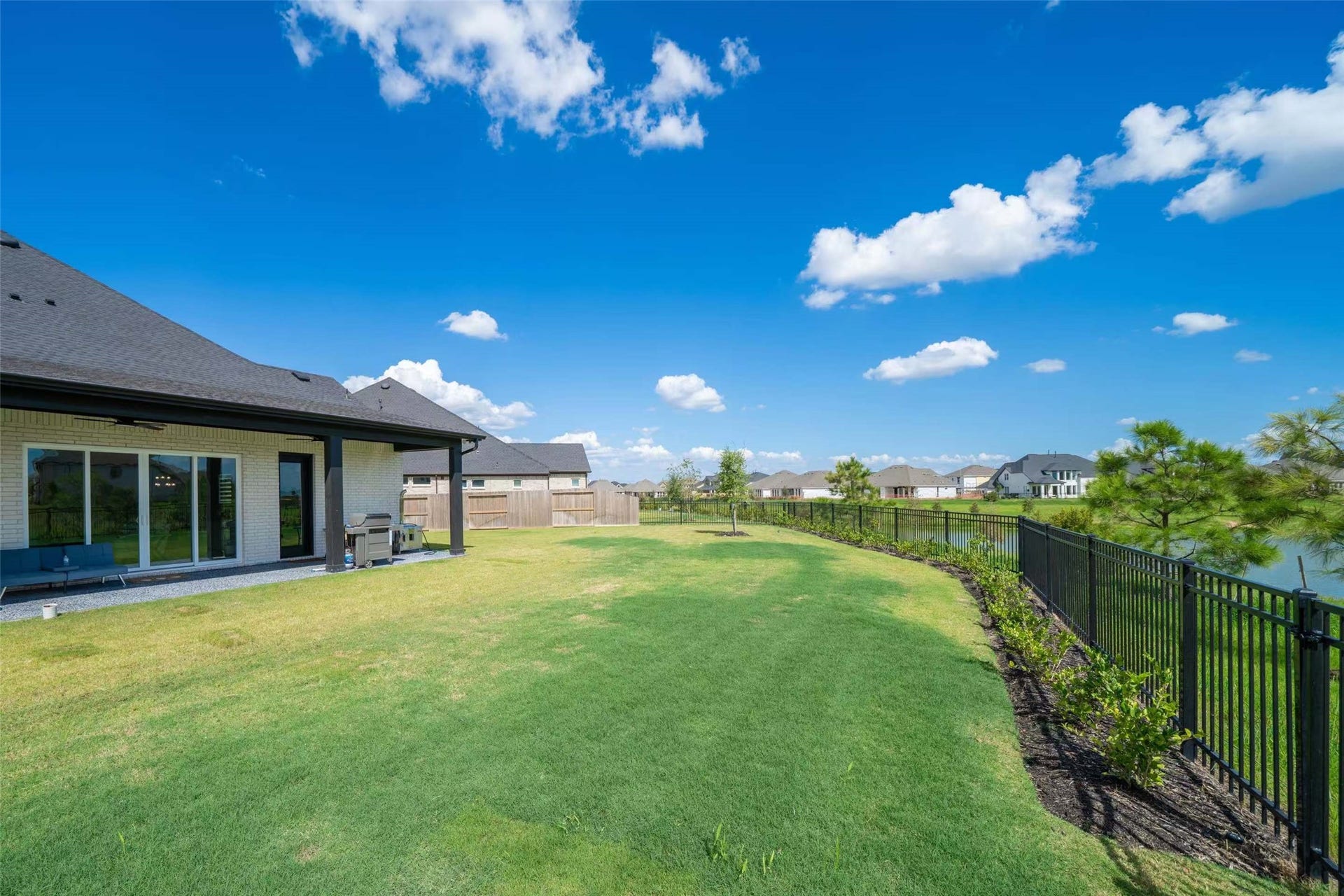 Enjoy lakefront living on an oversized 12,000+ sq. ft. lot featuring a spacious backyard, covered patio, and beautiful water views. Plenty of room for outdoor entertaining and relaxation!
