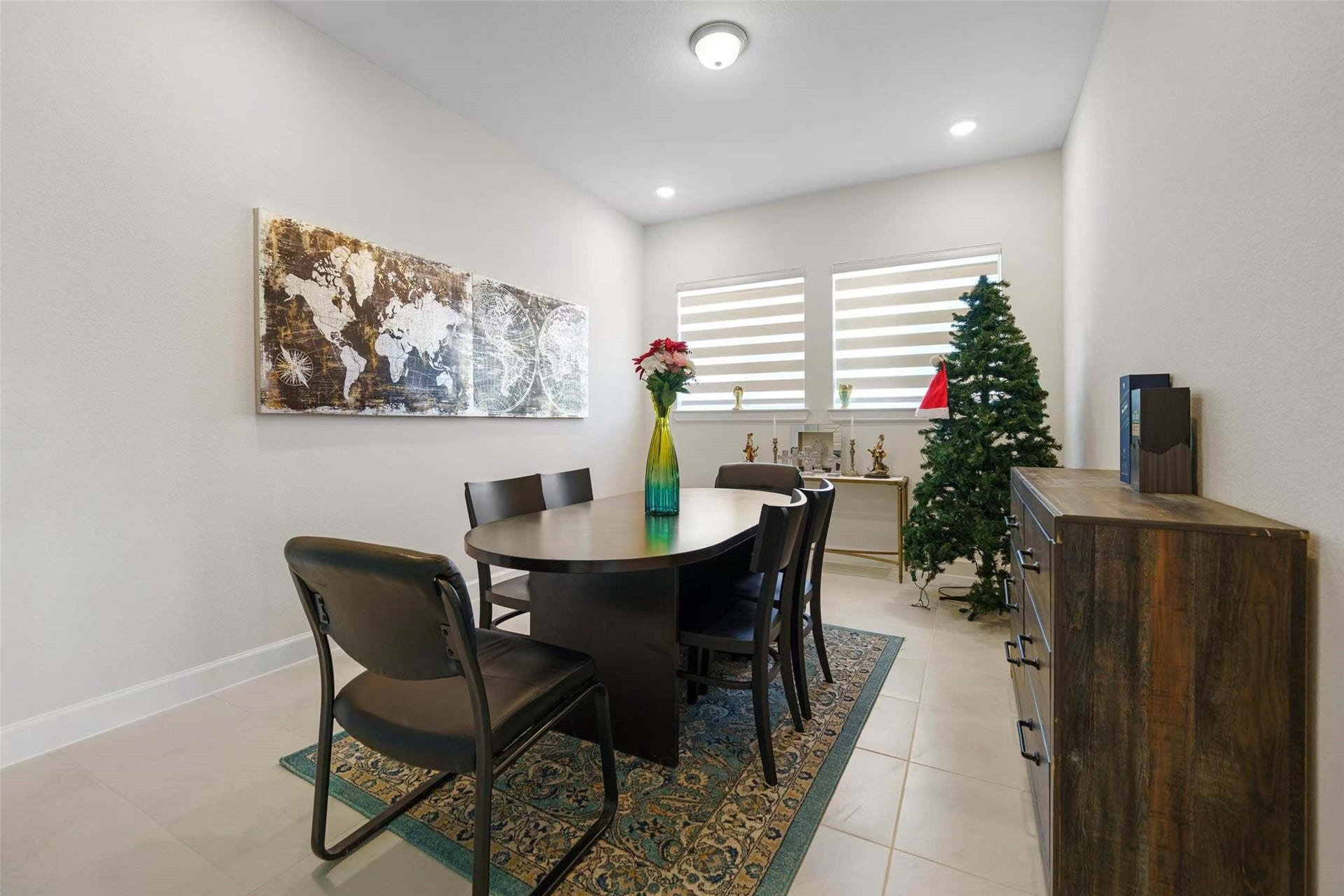 Versatile flex room with abundant natural light, perfect for a formal dining room, home office, or additional living space to suit your needs.