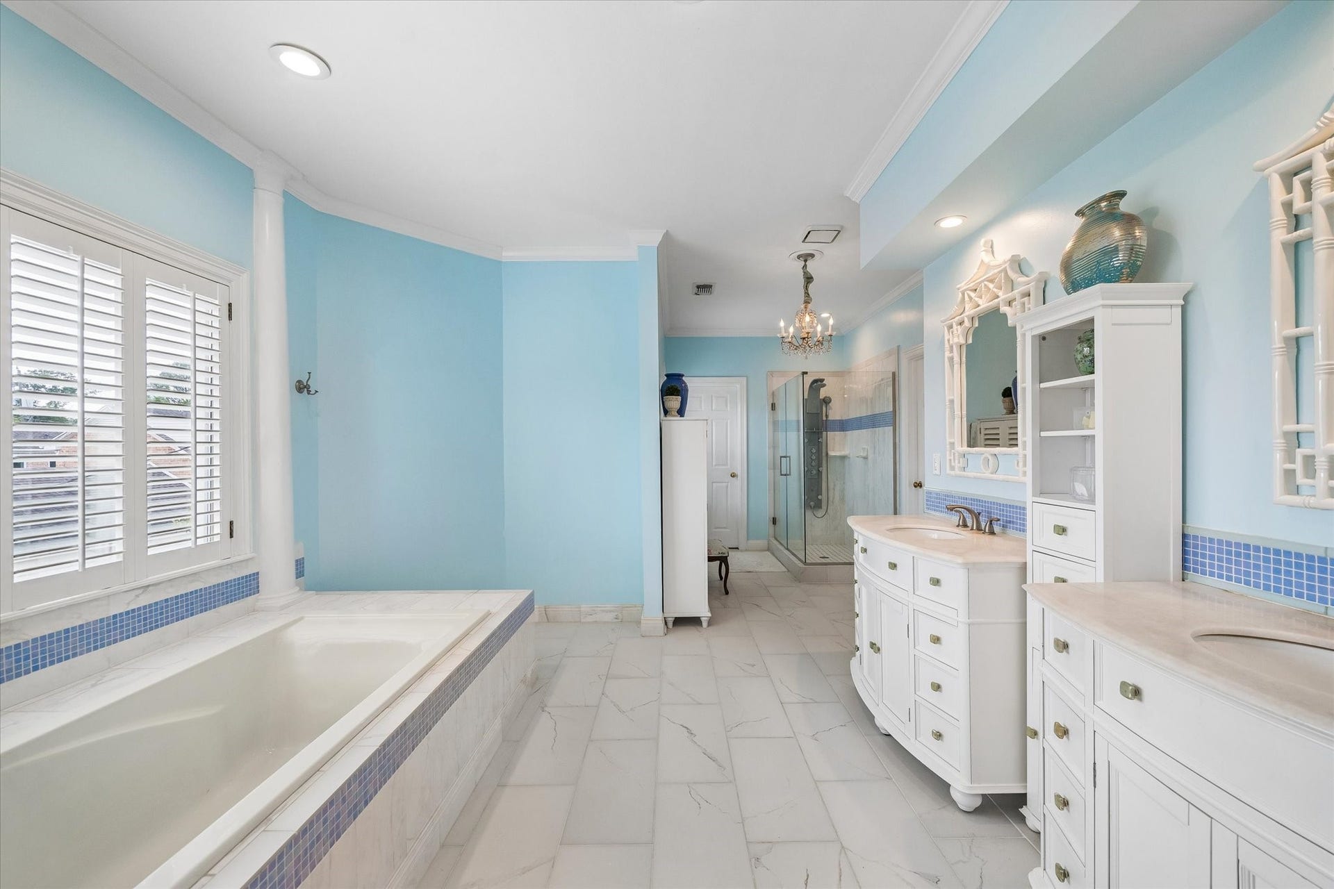 2120 Potomac Drive, #A, Houston, TX 77057 This spa-like primary bathroom is the perfect addition to the primary suite! Featuring dual sinks, separate glass shower, soaking tub, and two walk-in closets.