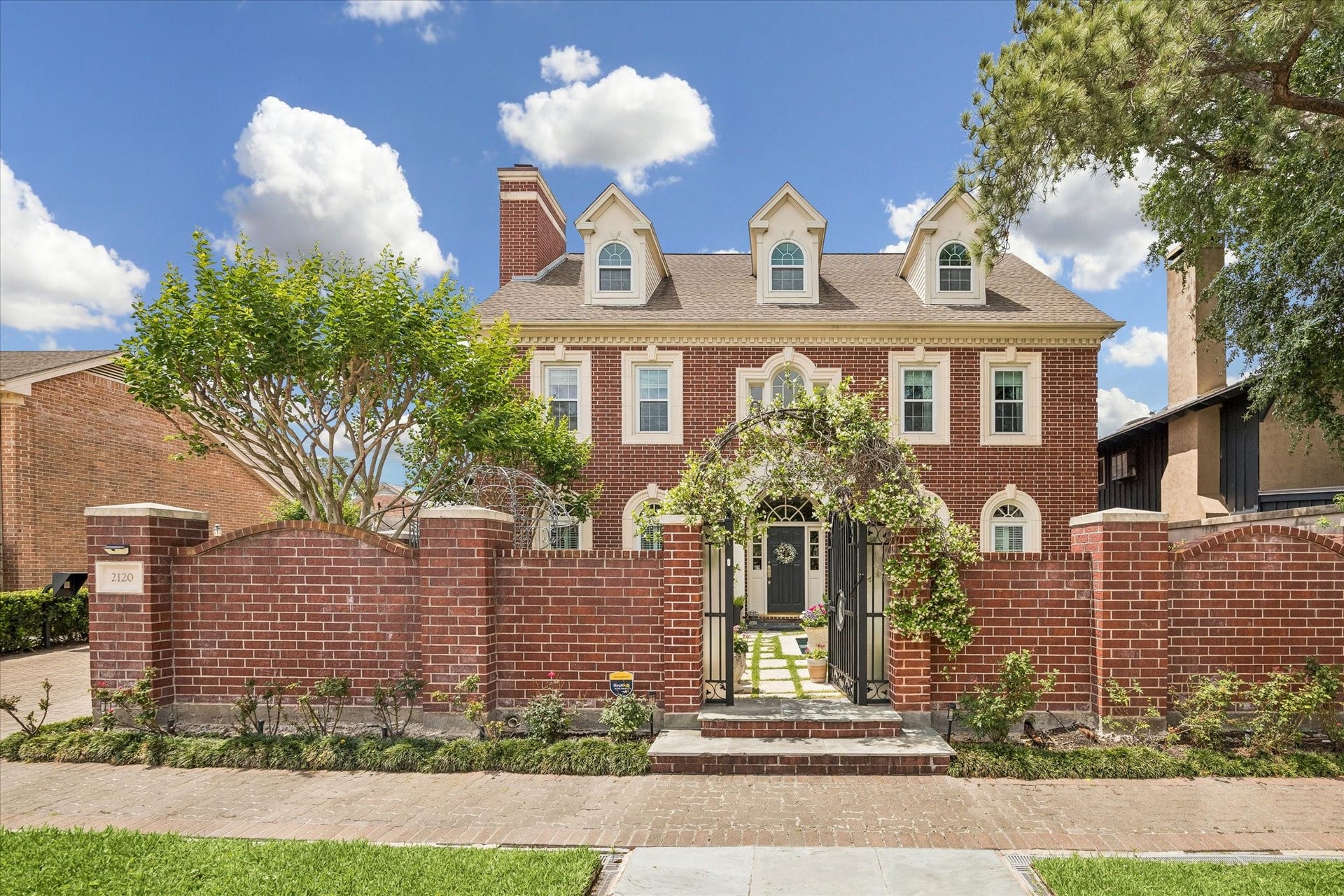 2120 Potomac Drive, #A, Houston, TX 77057 This stunning red brick home has gorgeous curb appeal. The gated front allows for privacy from the street.