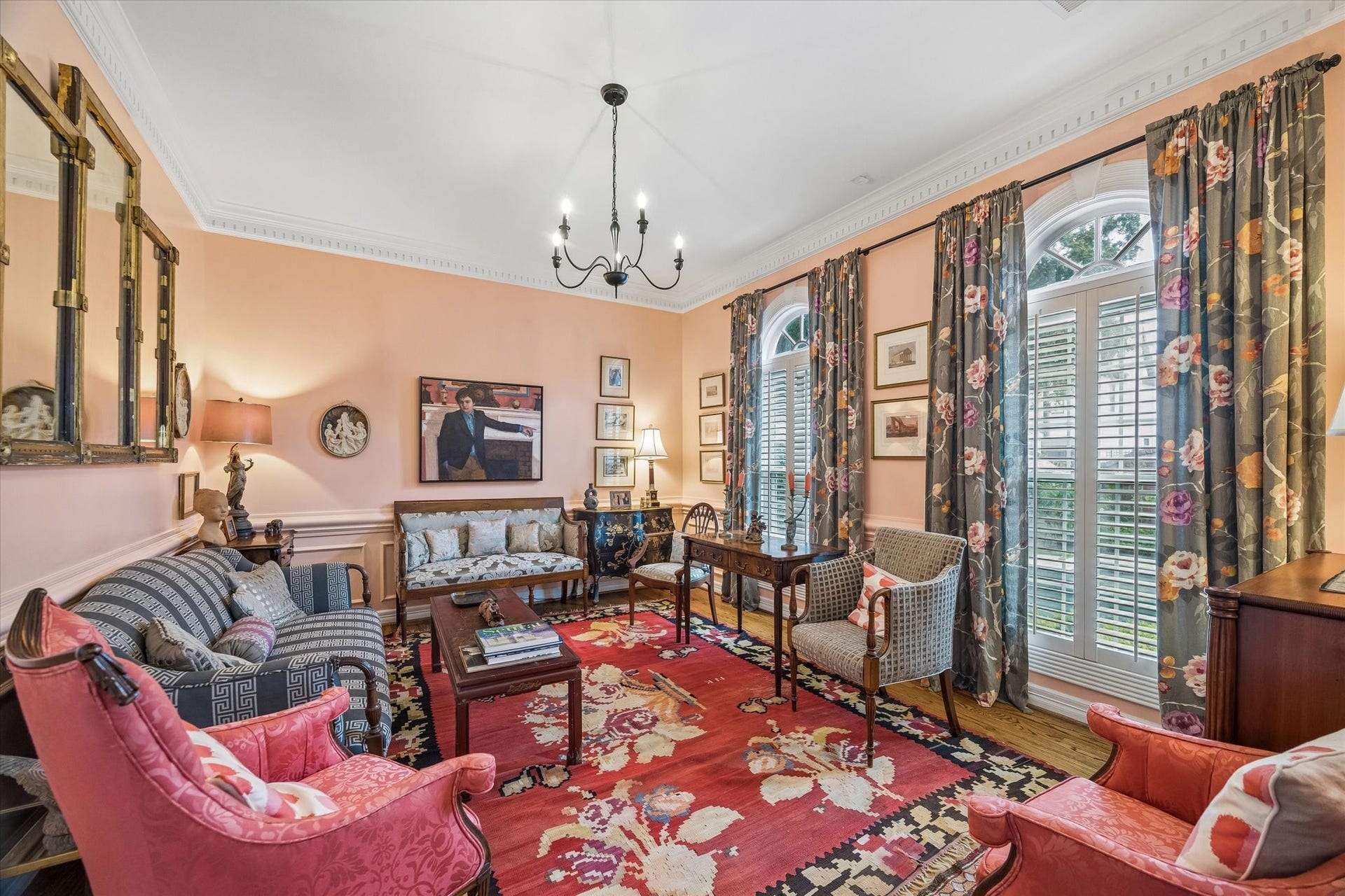 2120 Potomac Drive, #A, Houston, TX 77057 To the right of the entry is the formal living room. Hardwood floors, dental molding, and windows overlooking the pool accentuate the space. The painted wainscoting adds an elegant touch.