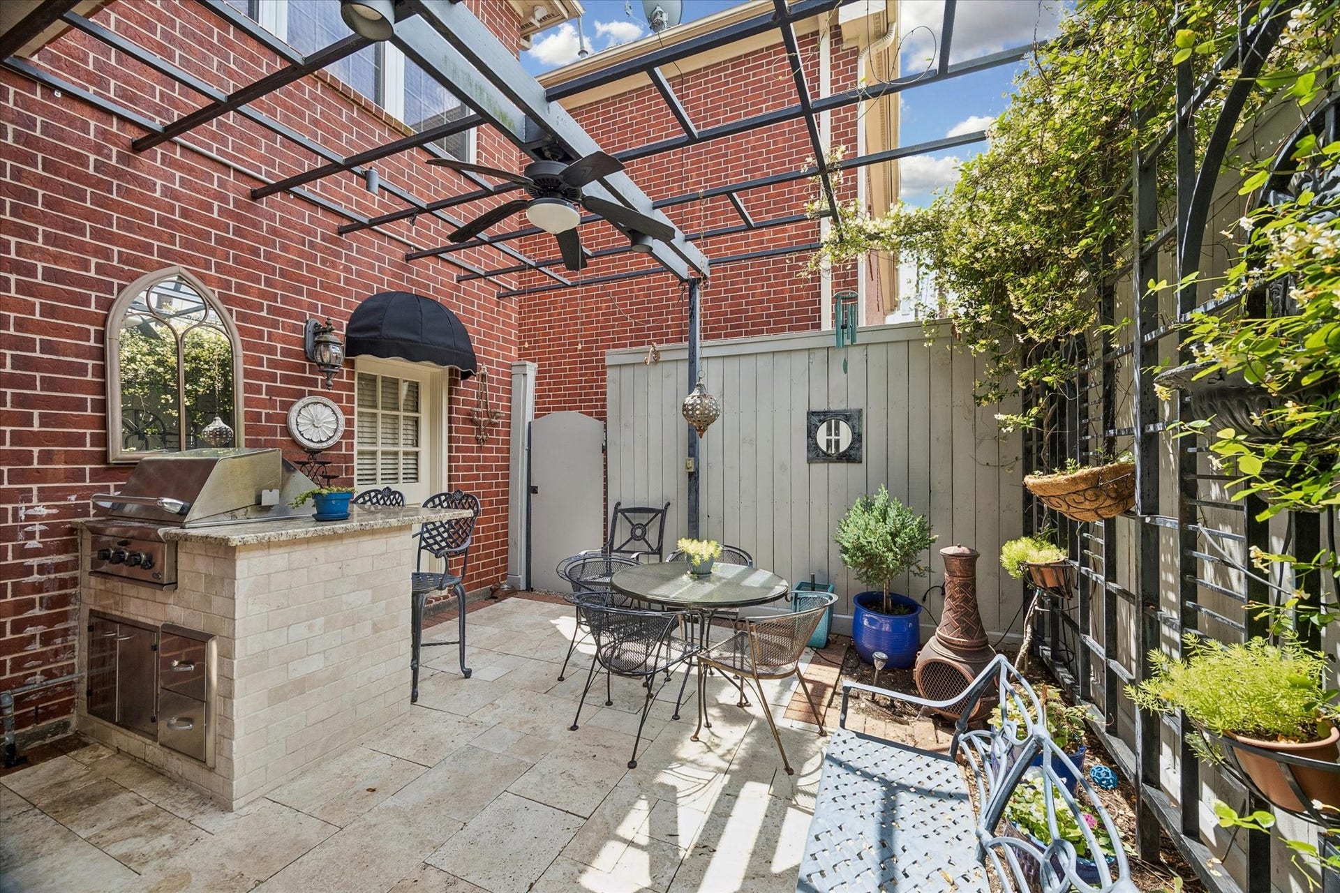 2120 Potomac Drive, #A, Houston, TX 77057 Just off the kitchen is the back patio. Featuring travertine tile, a gas grill, and pergola, this is the perfect place to wind down.