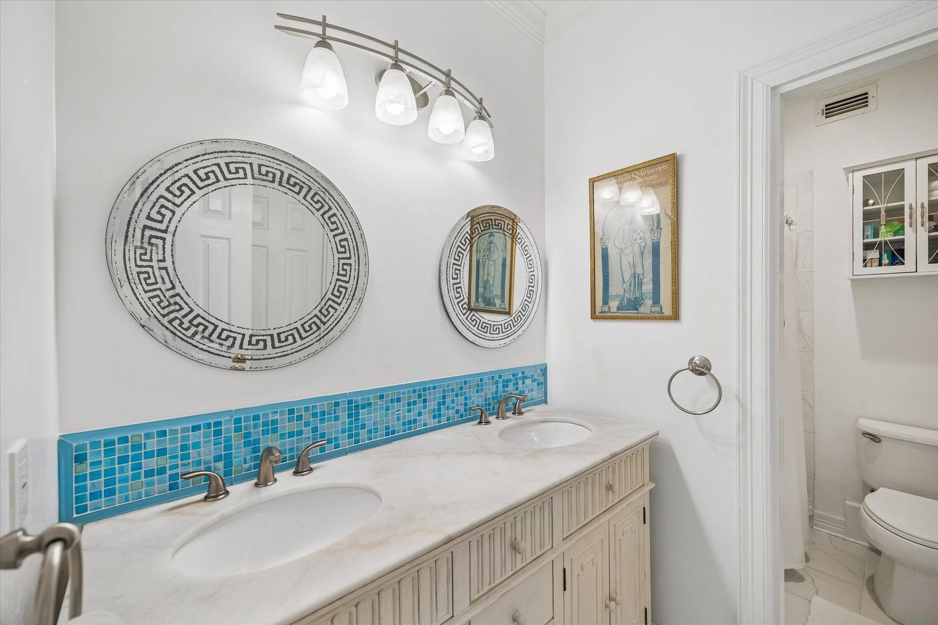 2120 Potomac Drive, #A, Houston, TX 77057 This secondary bathroom features a shower/bathtub, dual sinks, and plenty of under sink storage.