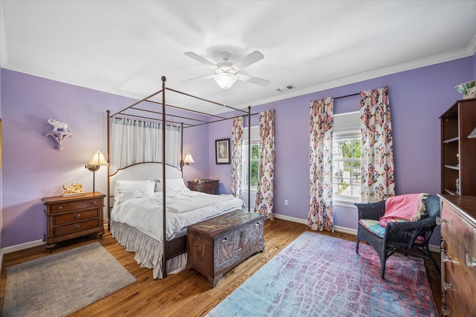2120 Potomac Drive, #A, Houston, TX 77057 The front secondary bedroom features beautiful lavender walls, hardwood floors, crown molding, and an en-suite bath with a walk-in closet.