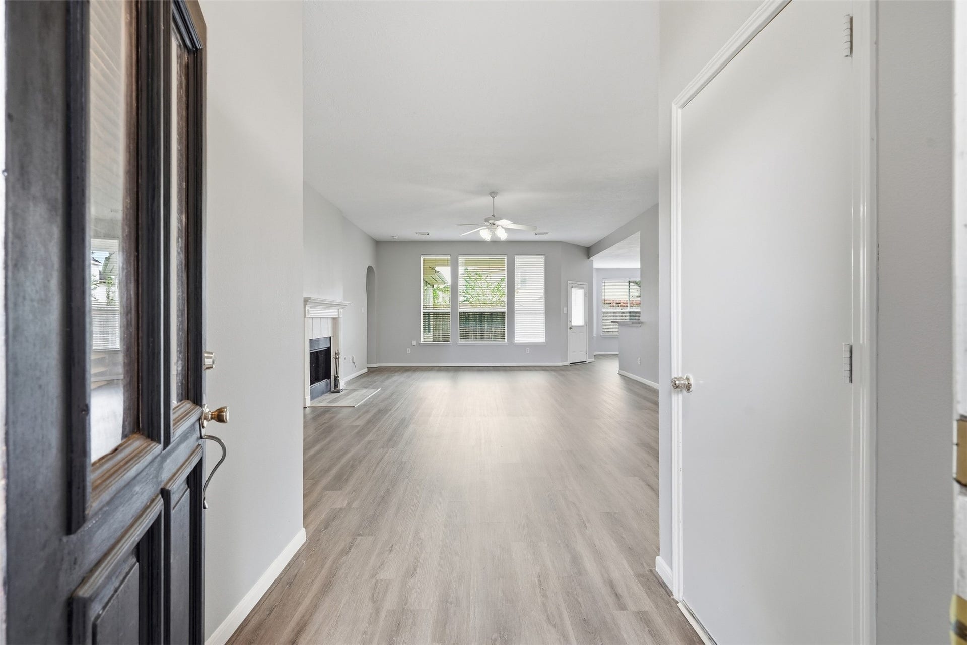 3003 Grey Mist Court, Friendswood, TX 77546 Welcoming entry with a view into the homes open living spaces.
