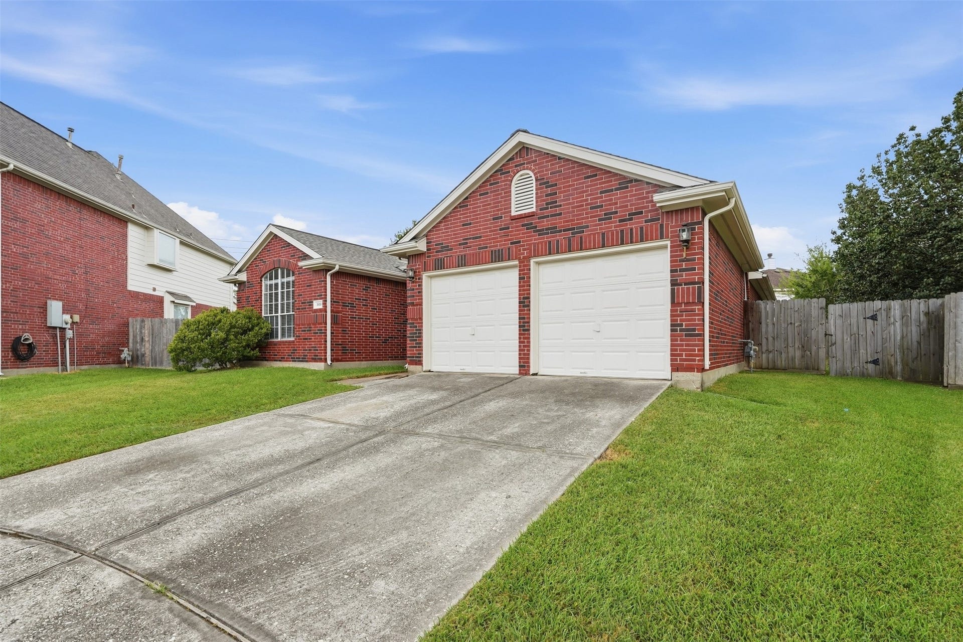3003 Grey Mist Court, Friendswood, TX 77546 Additional exterior view featuring the driveway and attached garage.