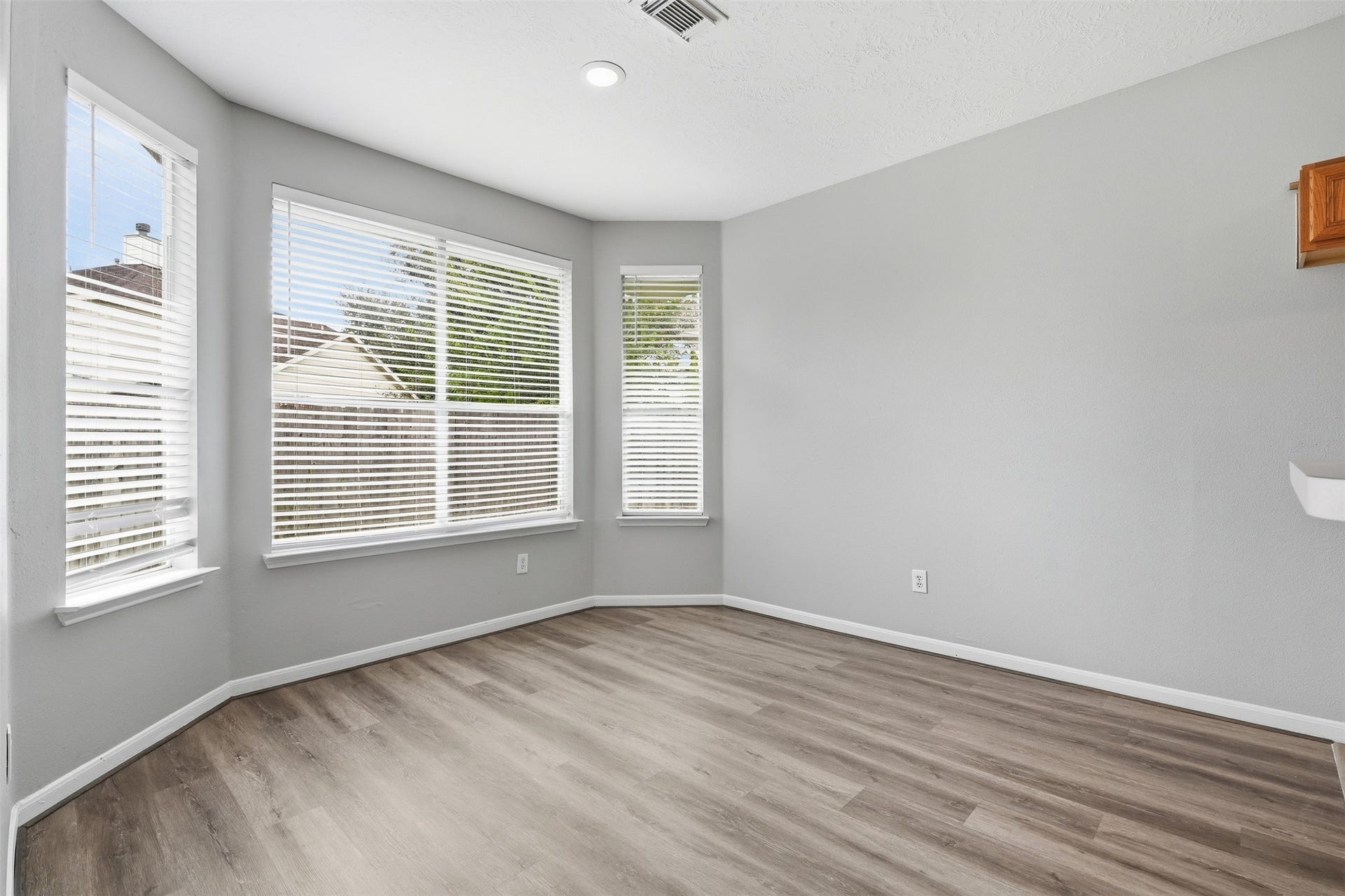 3003 Grey Mist Court, Friendswood, TX 77546 Bright breakfast area with multiple windows overlooking the exterior.