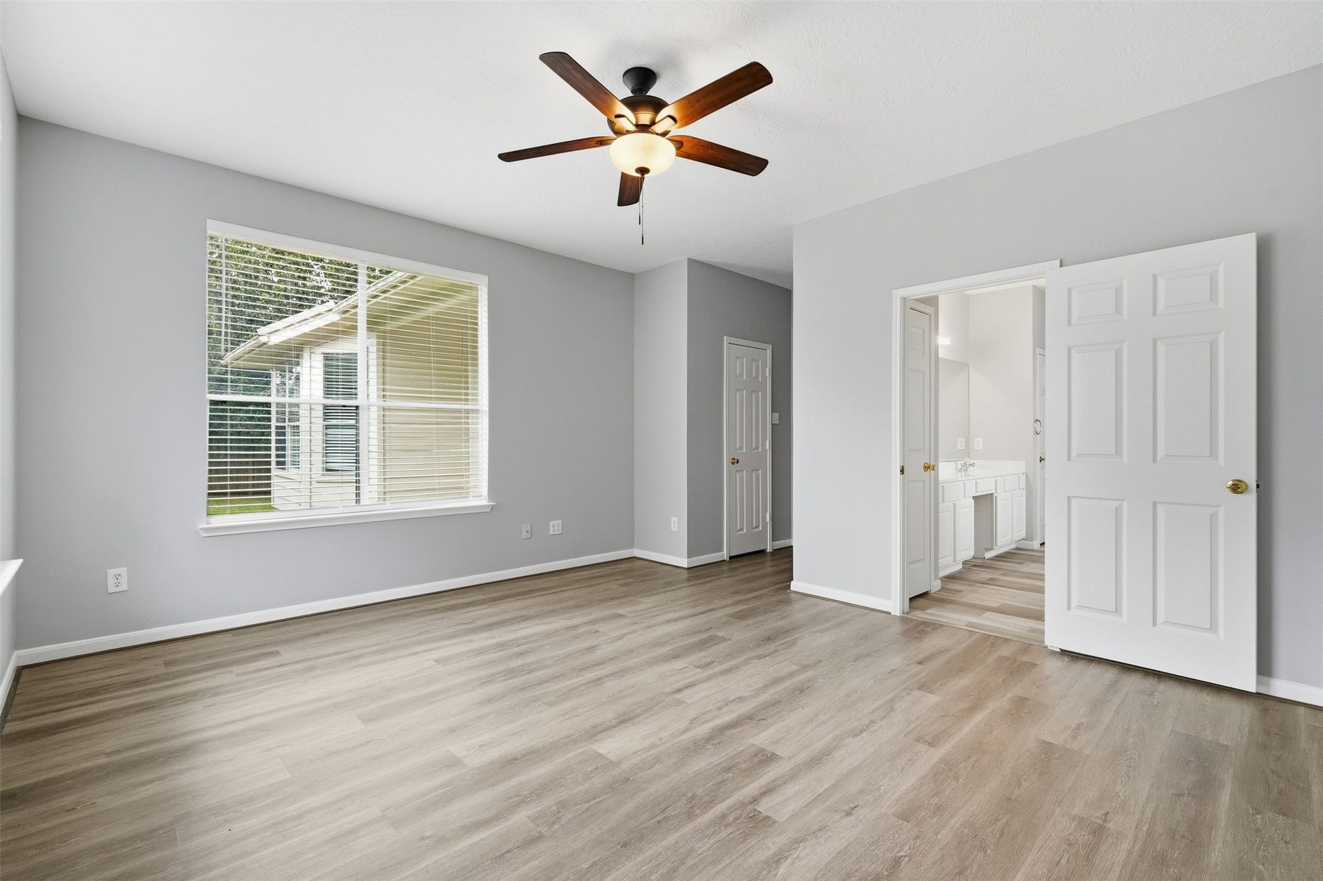 3003 Grey Mist Court, Friendswood, TX 77546 Spacious primary bedroom with natural light