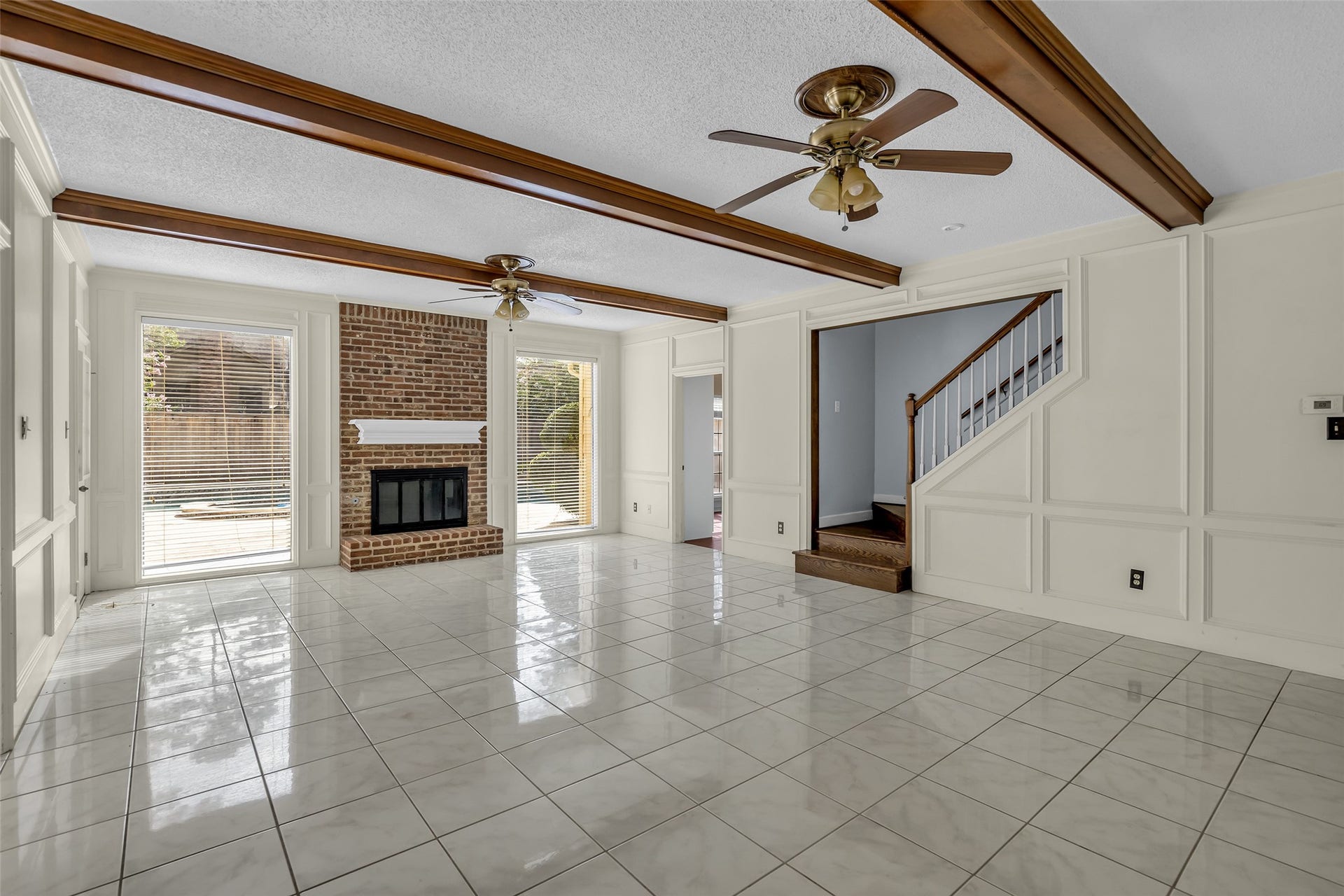 14014 Court Of Regents, Houston, TX 77069 As you step past the foyer, you'll be greeted by a view of the inviting family room.