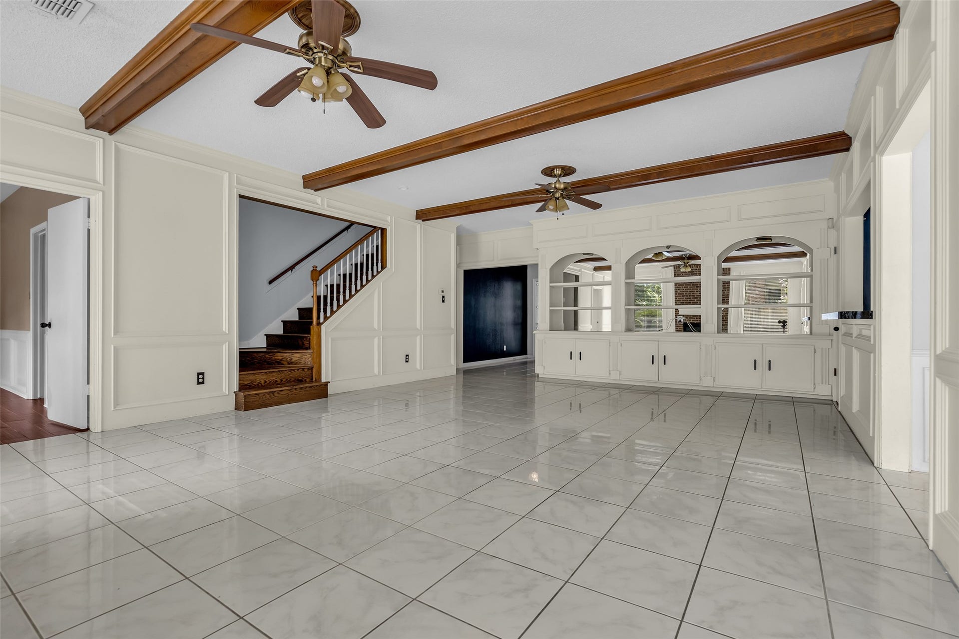 14014 Court Of Regents, Houston, TX 77069 It also features tile flooring and a vaulted ceiling, creating an open and airy feel.