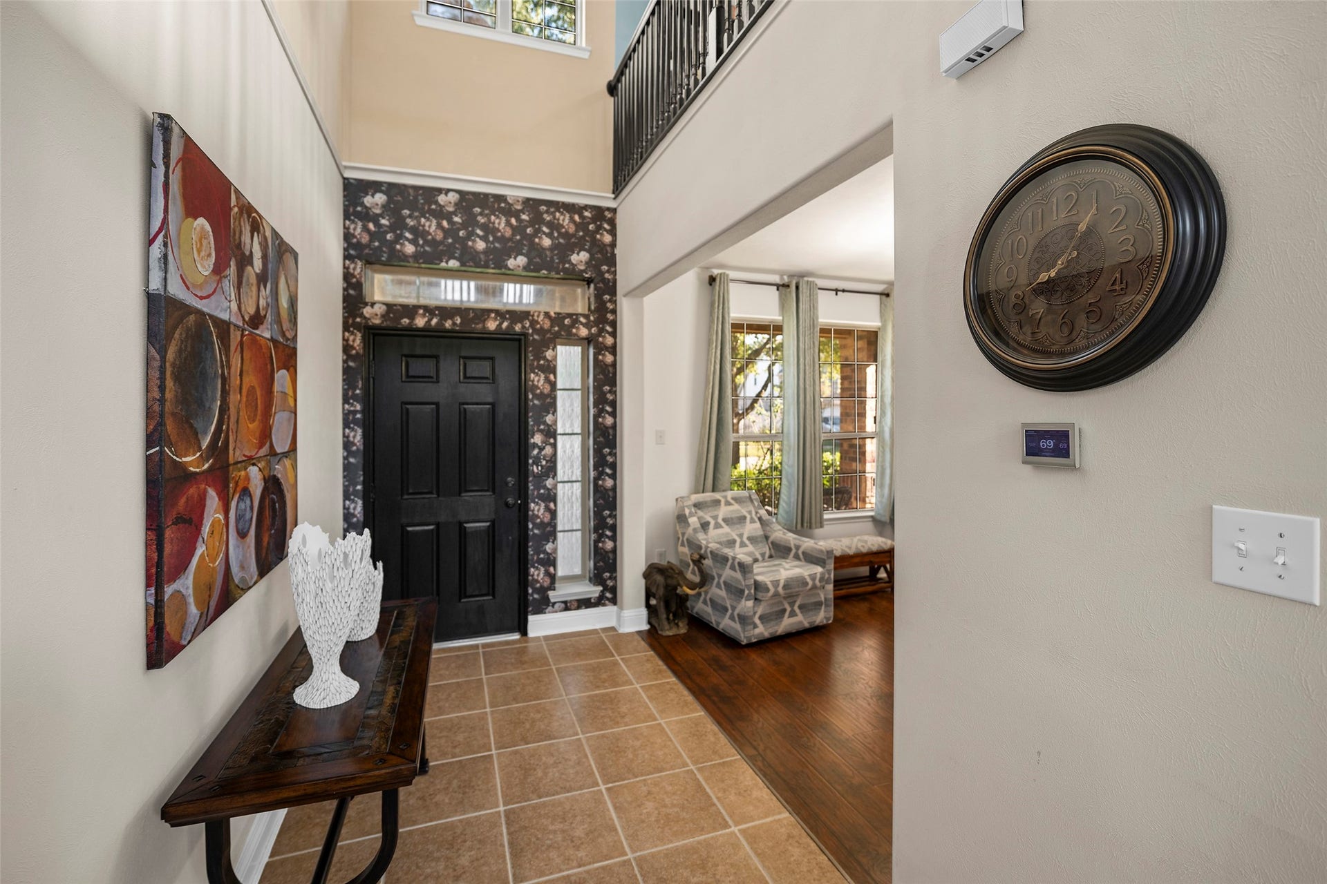 Grand entry hall featuring soaring ceilings and an abundance of natural light.