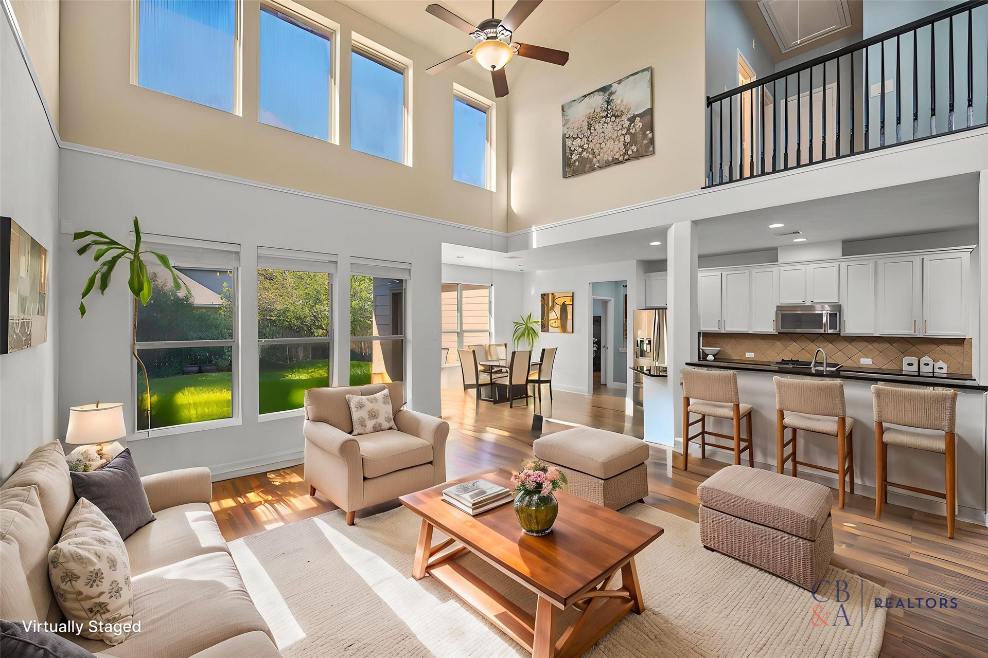Bright, modern open-concept floor plan featuring a stunning wall of windows that floods the space with natural light and makes this home truly one-of-a-kind.