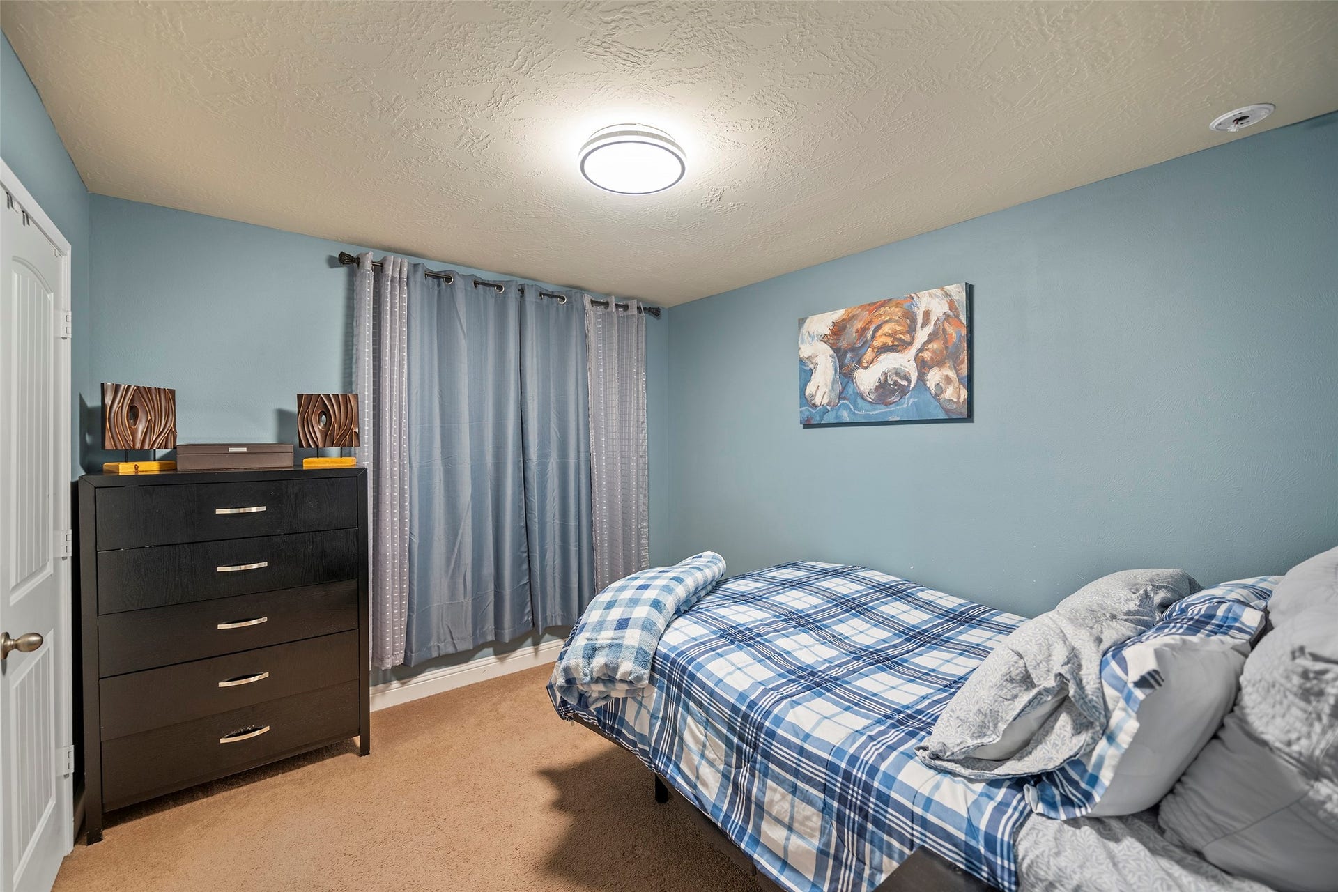 Secondary bedroom located on the second floor.