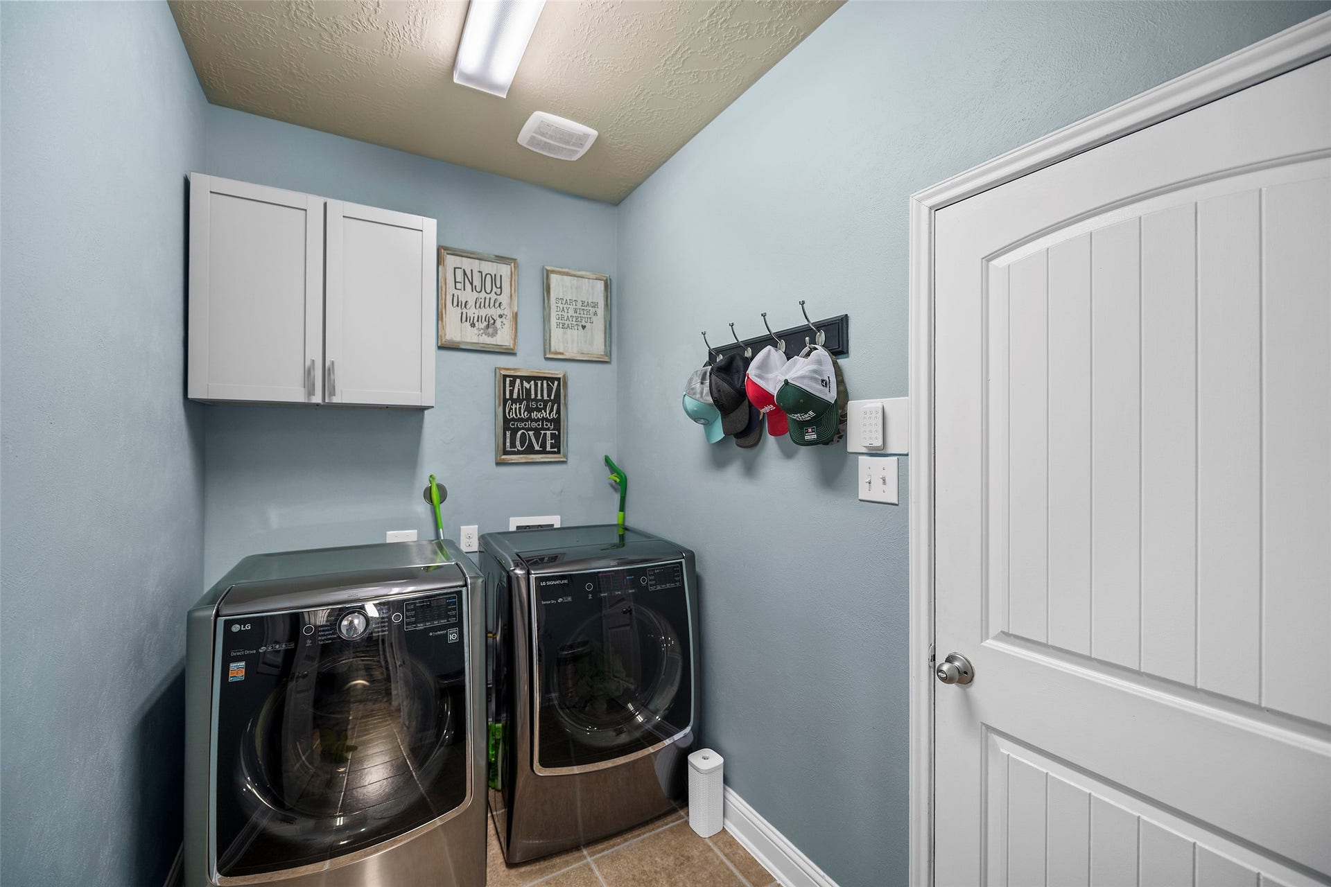 The laundry room is located in-home. Please note that the washer an dryer are excluded form the sale.