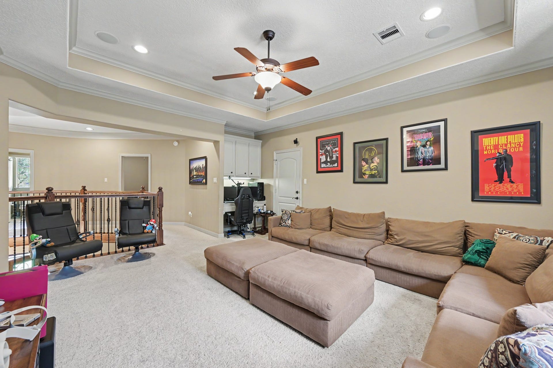 27706 Braydon Court, Spring, TX 77386 Spacious media/game room on the second floor featuring a built-in office nook is perfect for entertainment and relaxation.