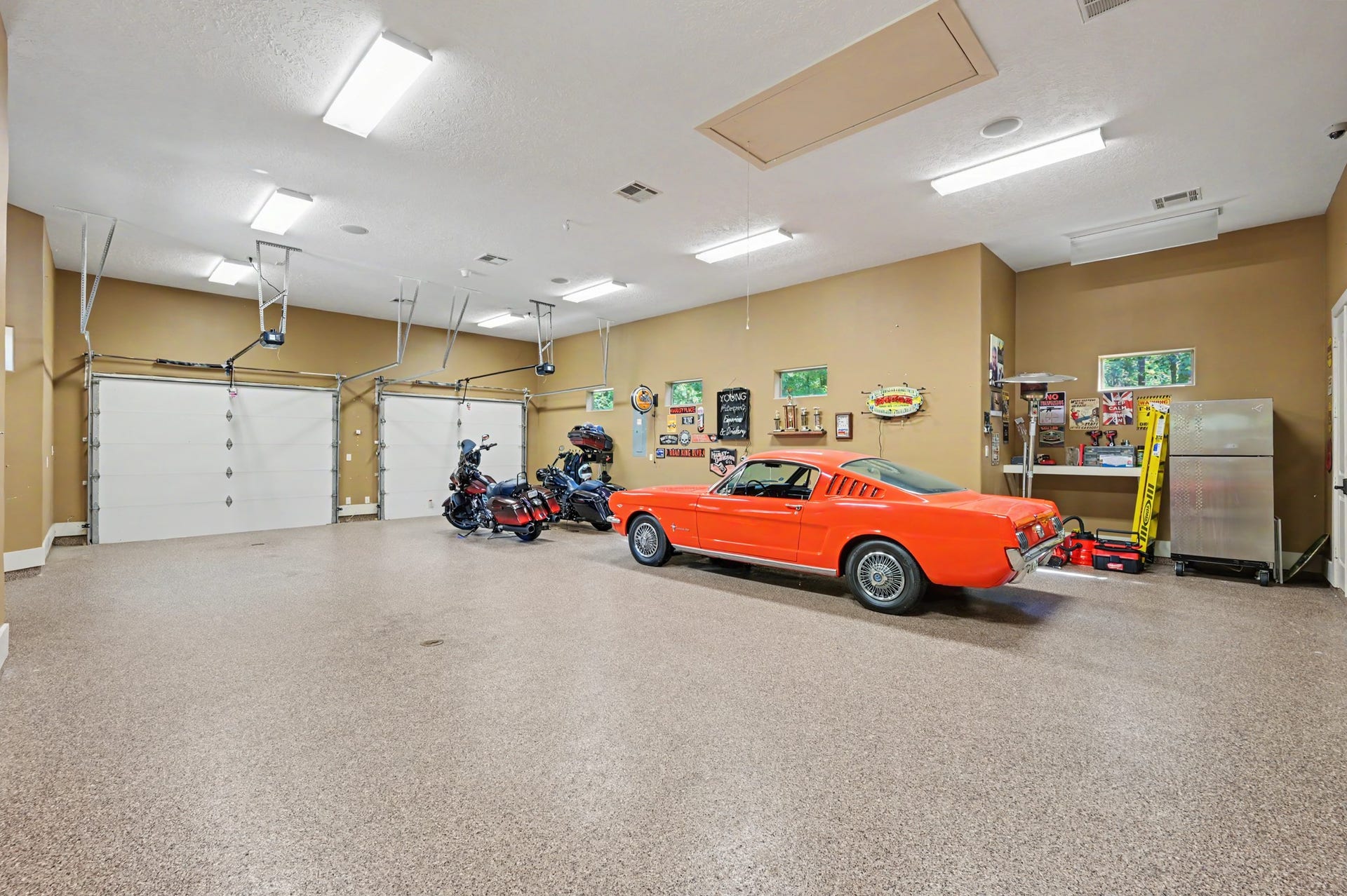 27706 Braydon Court, Spring, TX 77386 Spacious multi-car garage with ample room for vehicles and storage, featuring polished floors and bright lighting.