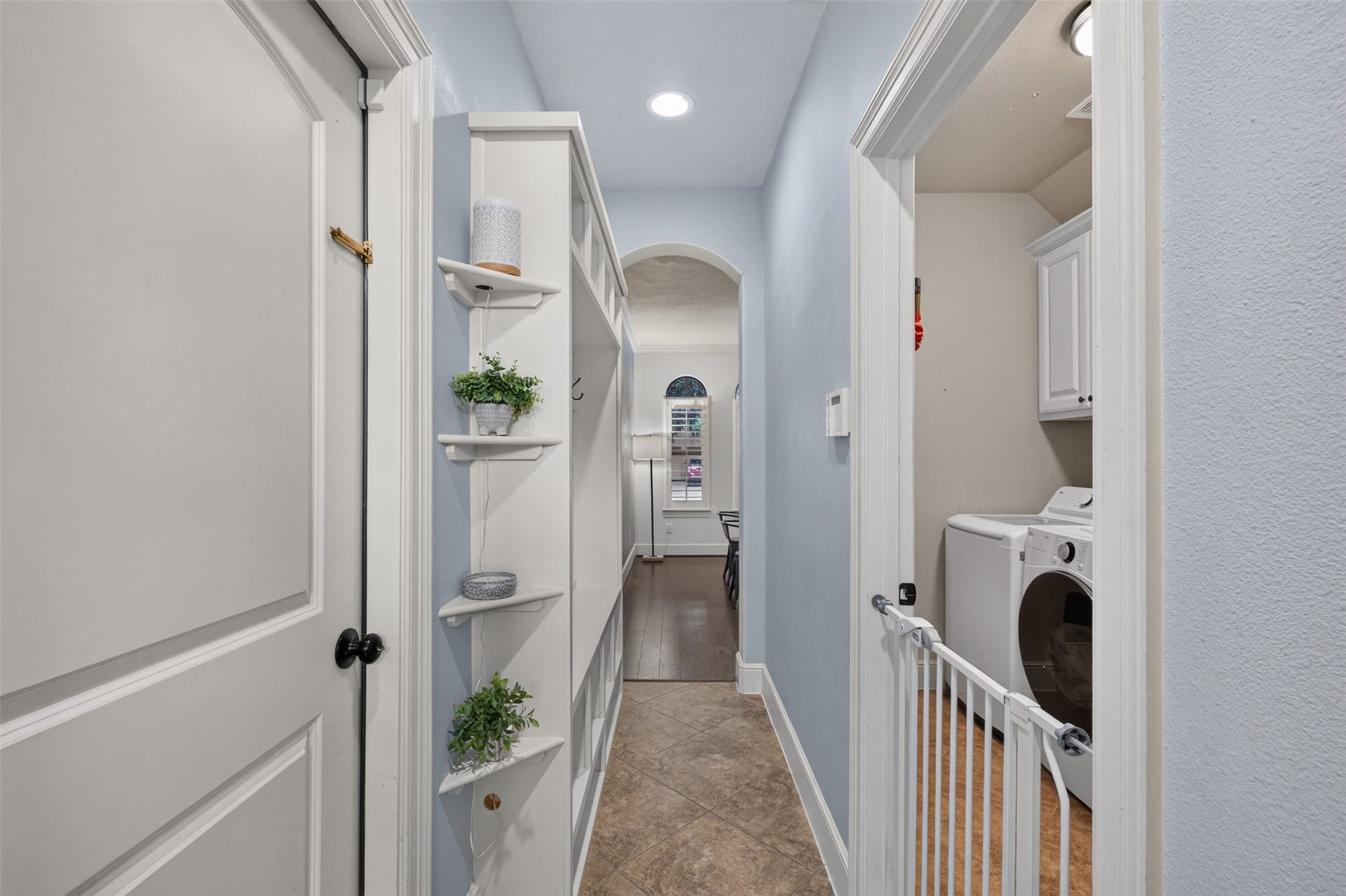 2806 Texas Laurel Drive, Katy, TX 77494 Hallway leading from the kitchen to the dining room includes built in coat and storage rack.