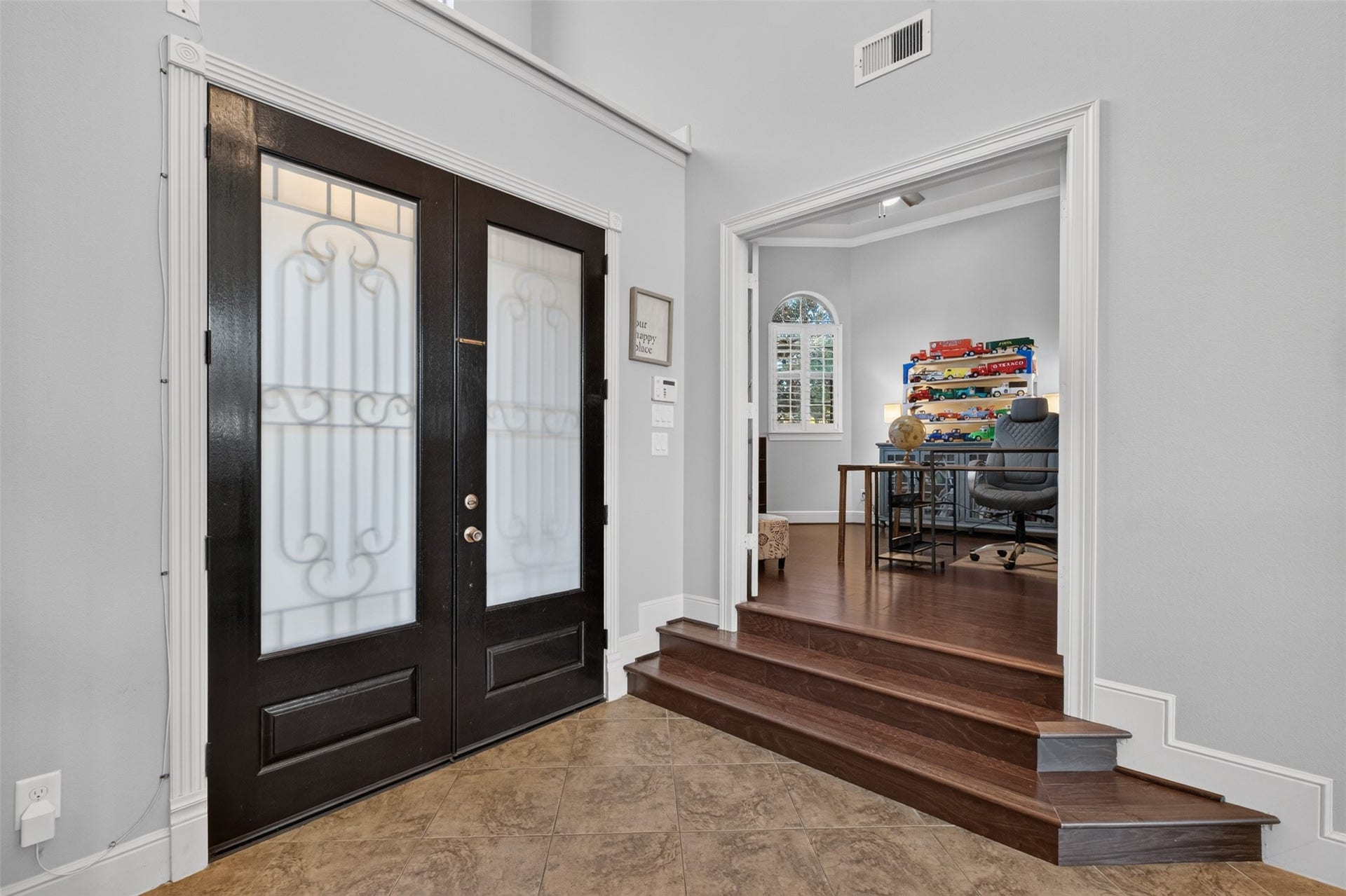 2806 Texas Laurel Drive, Katy, TX 77494 Steps lead to the glass French doors to the study/home office. Fabulous space with plenty of privacy for home working, with wood floors and crown molding