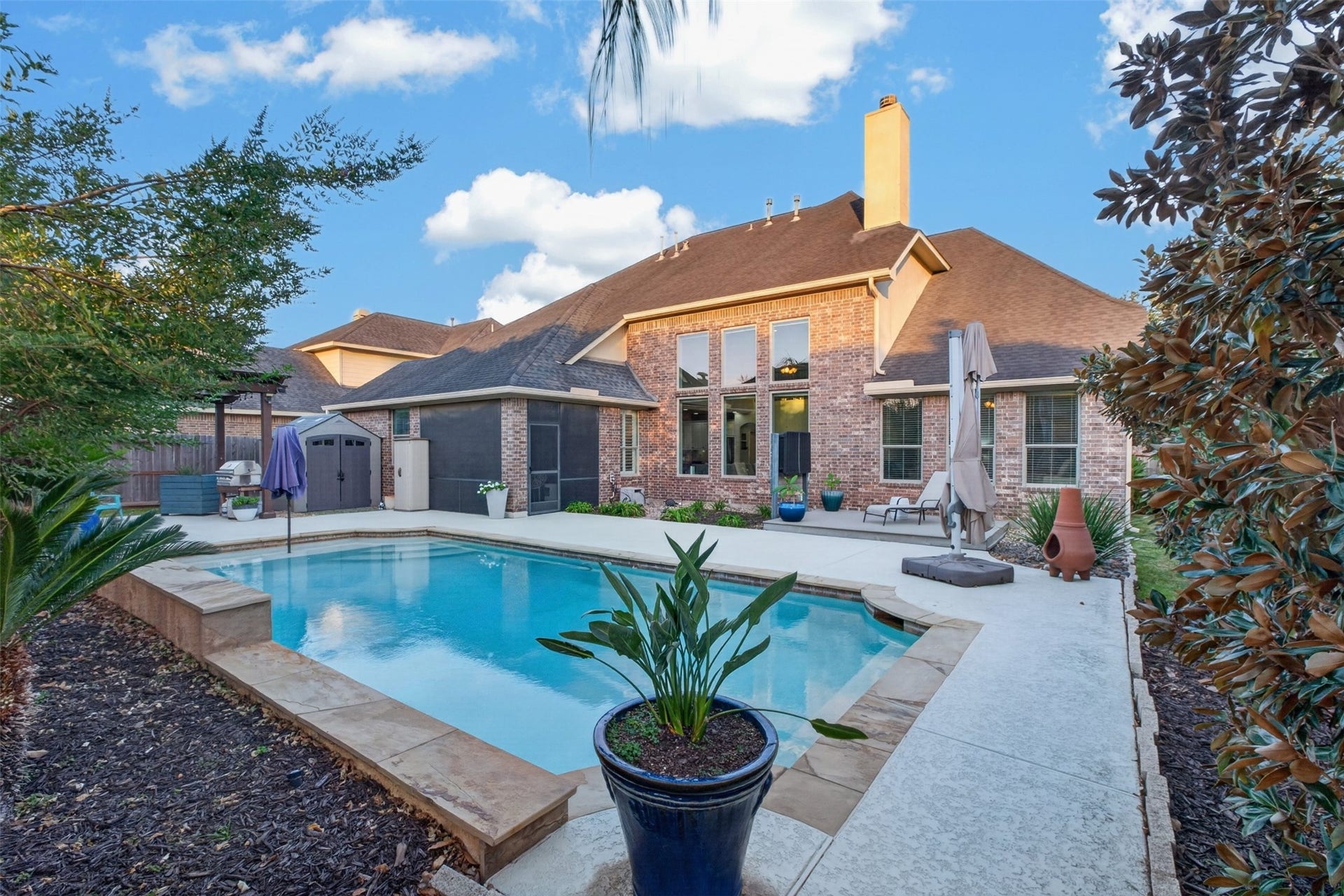 2806 Texas Laurel Drive, Katy, TX 77494 View of the beautiful backyard with separate entertaining spaces from the covered back porch, gazebo to the left and raised deck