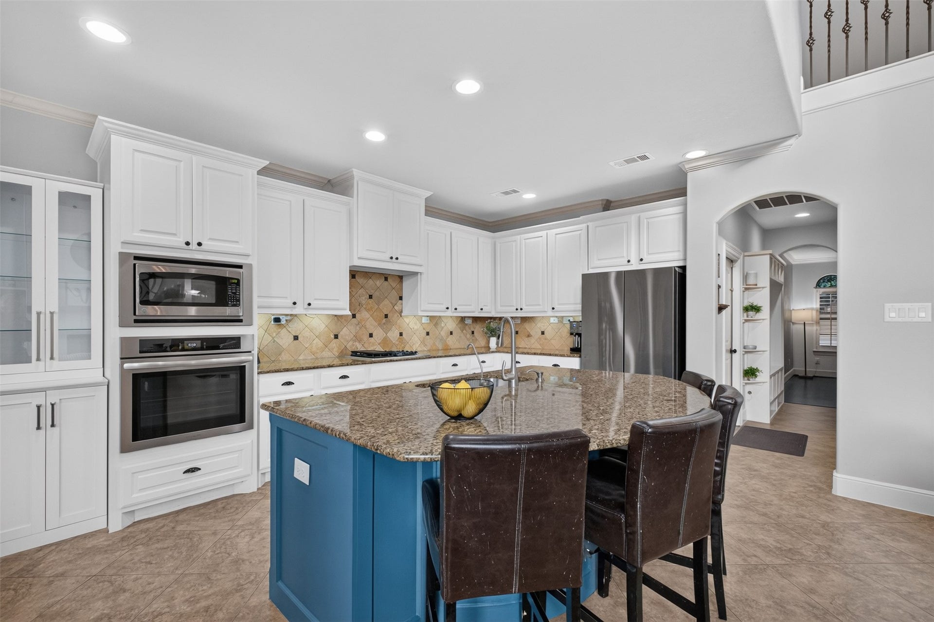 2806 Texas Laurel Drive, Katy, TX 77494 The kitchen has upgraded appliances and a large island for prep space and seating.