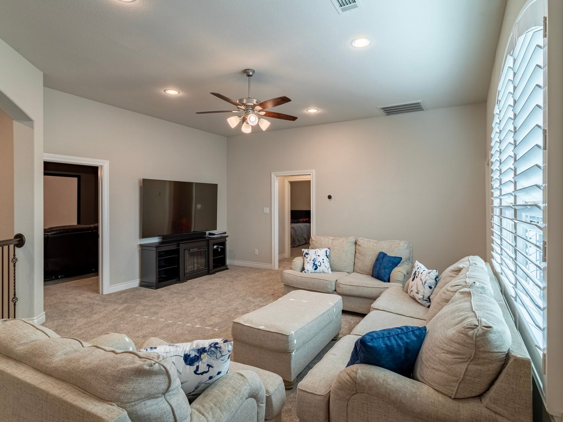 17429 Orchid Falls Lane, Conroe, TX 77302 Game room looking into Media room and towards hall to 2 secondary bedrooms