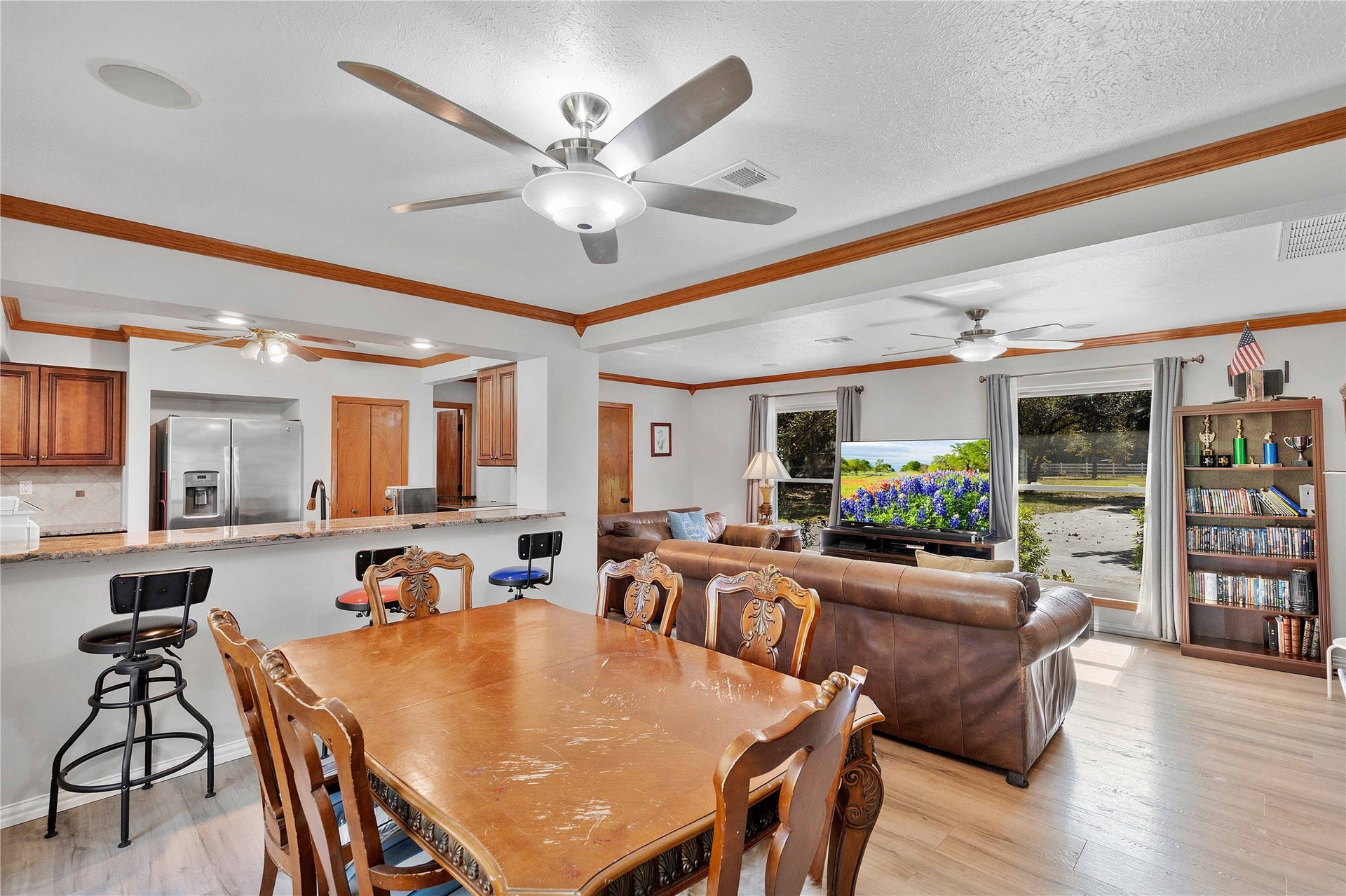 Large room that can be used as a game room/family room/flex area with bar and sink area