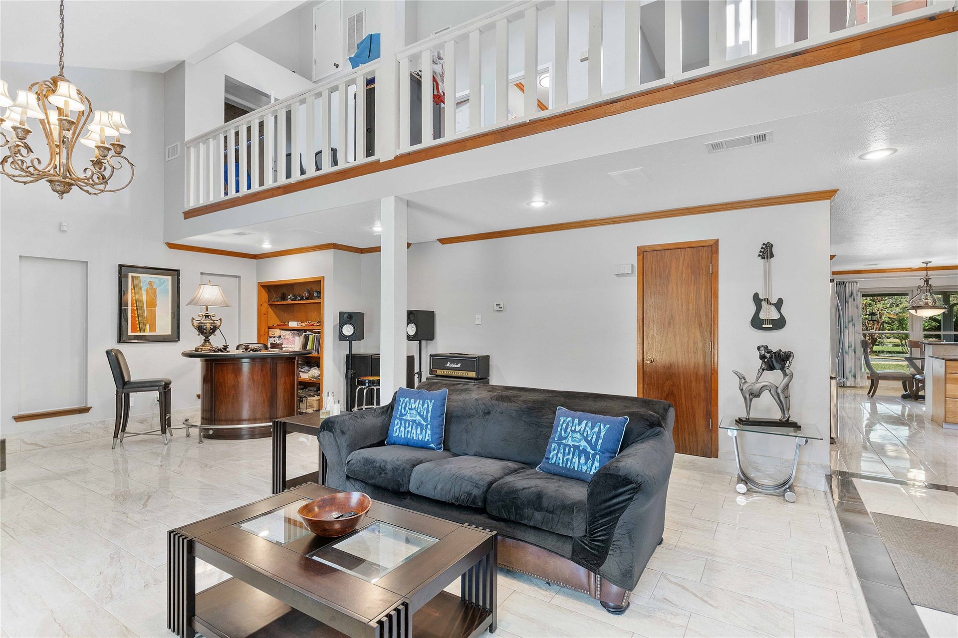 Another view of the front living area.  Upstair hallway looks down to the living room