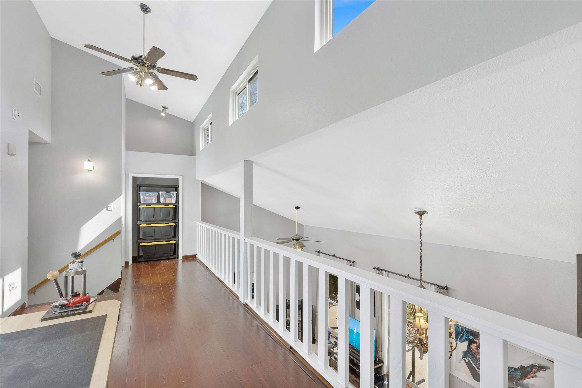 The upstair hallway that overlooks to the living area downstairs