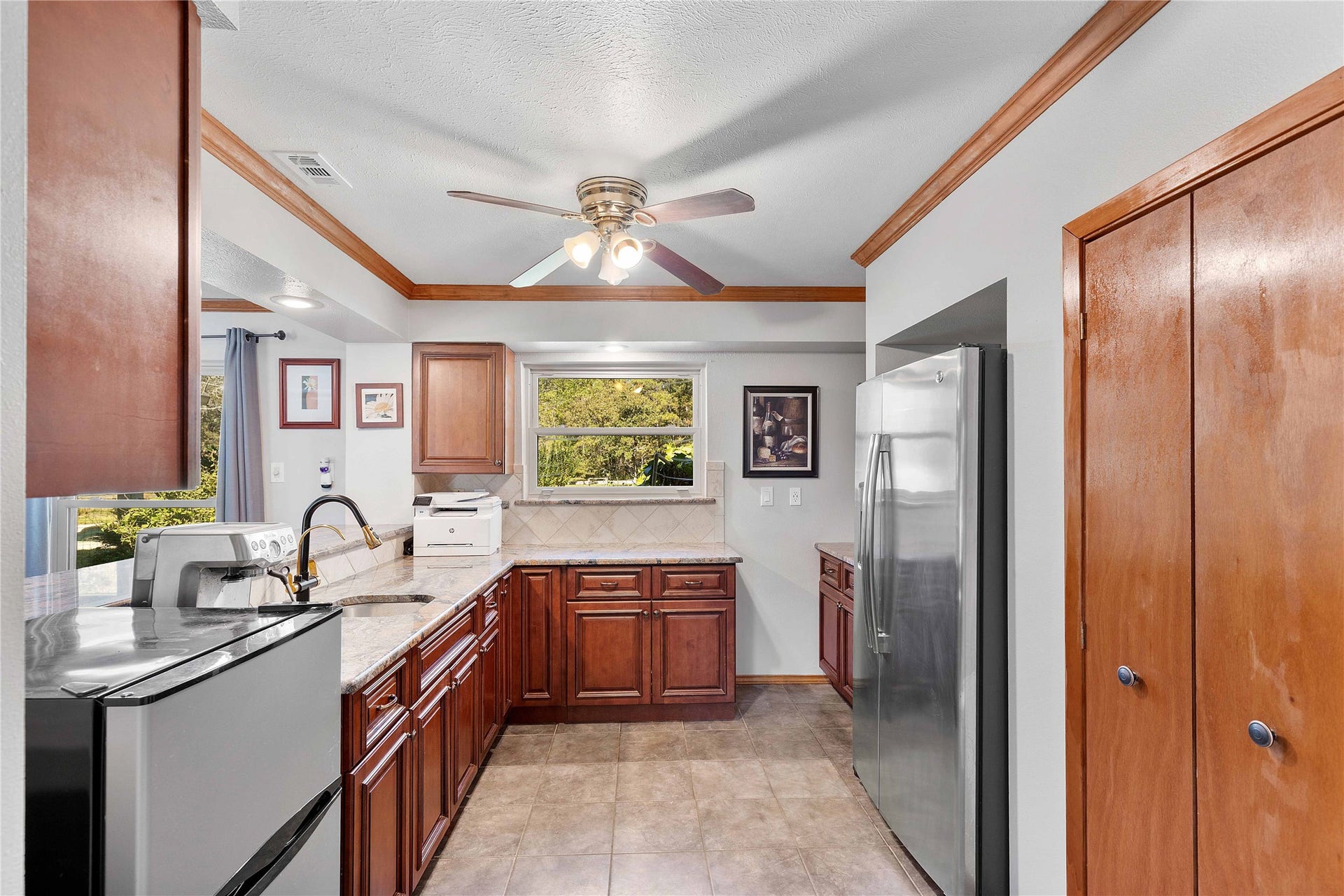 bar area with sink and room for the refrigerator