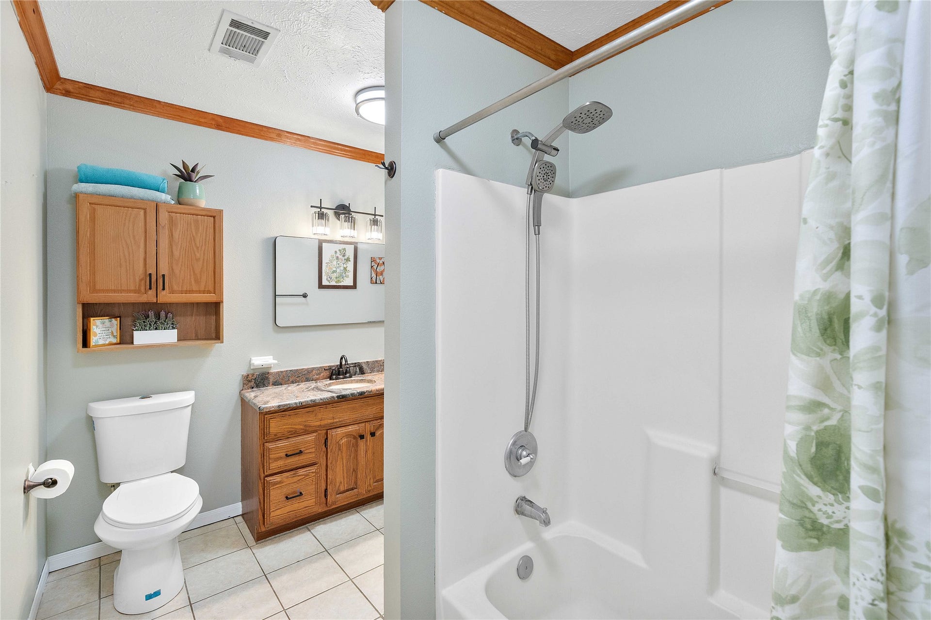 Full bathroom upstairs that connects to a bedroom and opens to the hallway