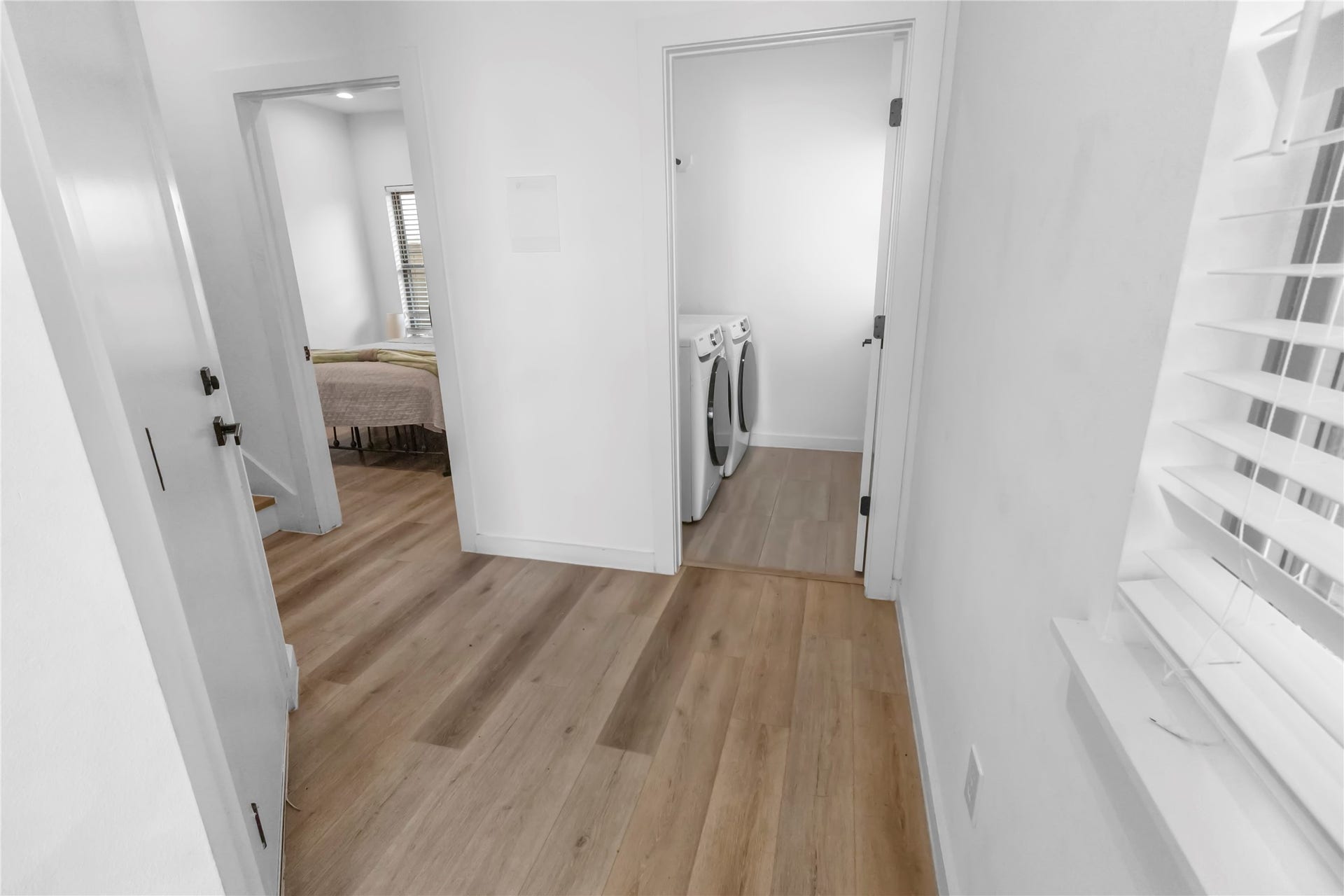 6742 Peerless Street, #B, Houston, TX 77021 Welcoming entry features clean architectural lines, contemporary finishes, and durable wood look flooring that immediately sets the tone for the homes modern aesthetic.