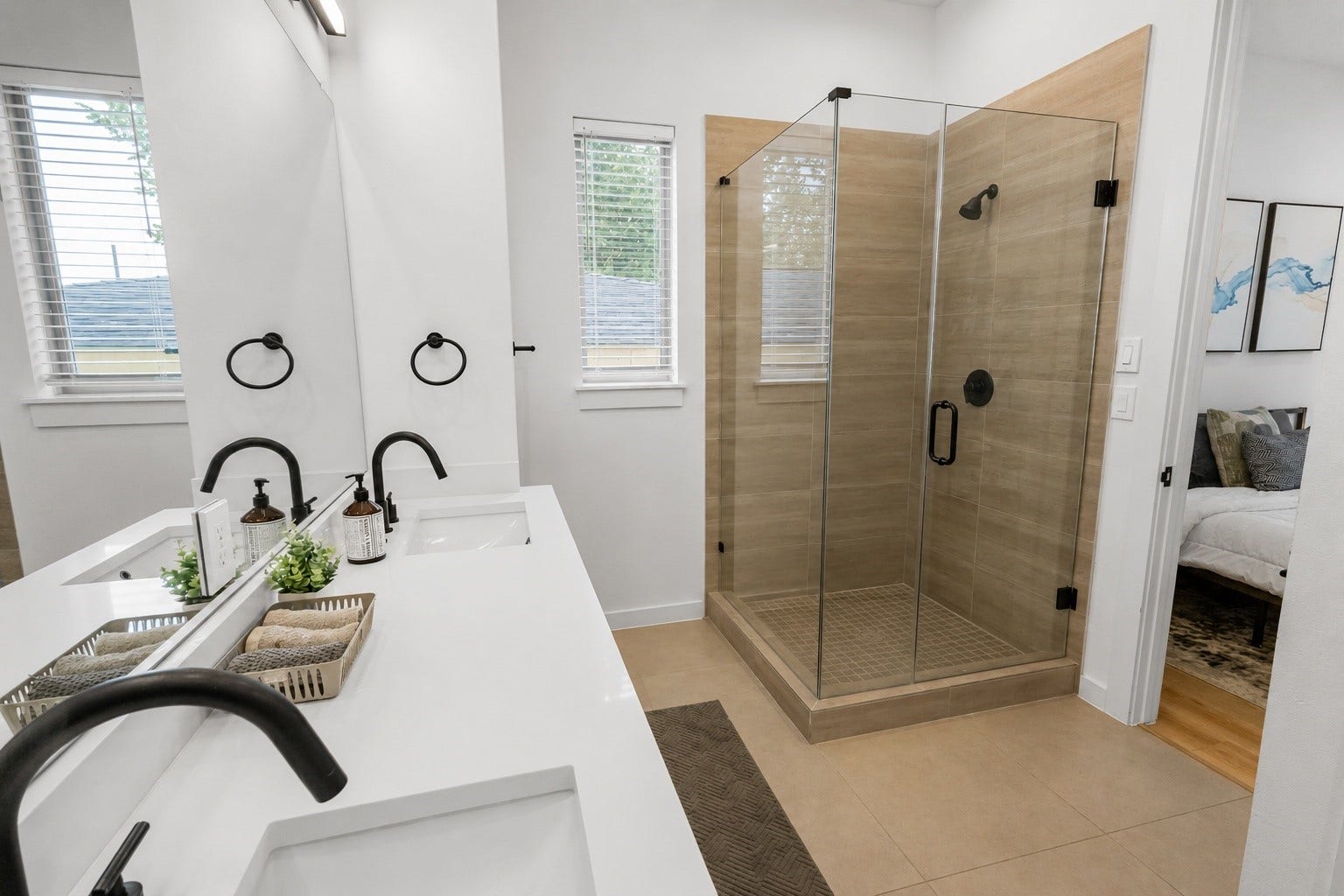6742 Peerless Street, #B, Houston, TX 77021 Modern finishes elevate this spa inspired primary bath with a frameless glass shower, oversized vanity, quartz countertops, matte black fixtures, and warm porcelain tile. Clean lines and timeless materials create a polished space that blends style with everyday functionality.