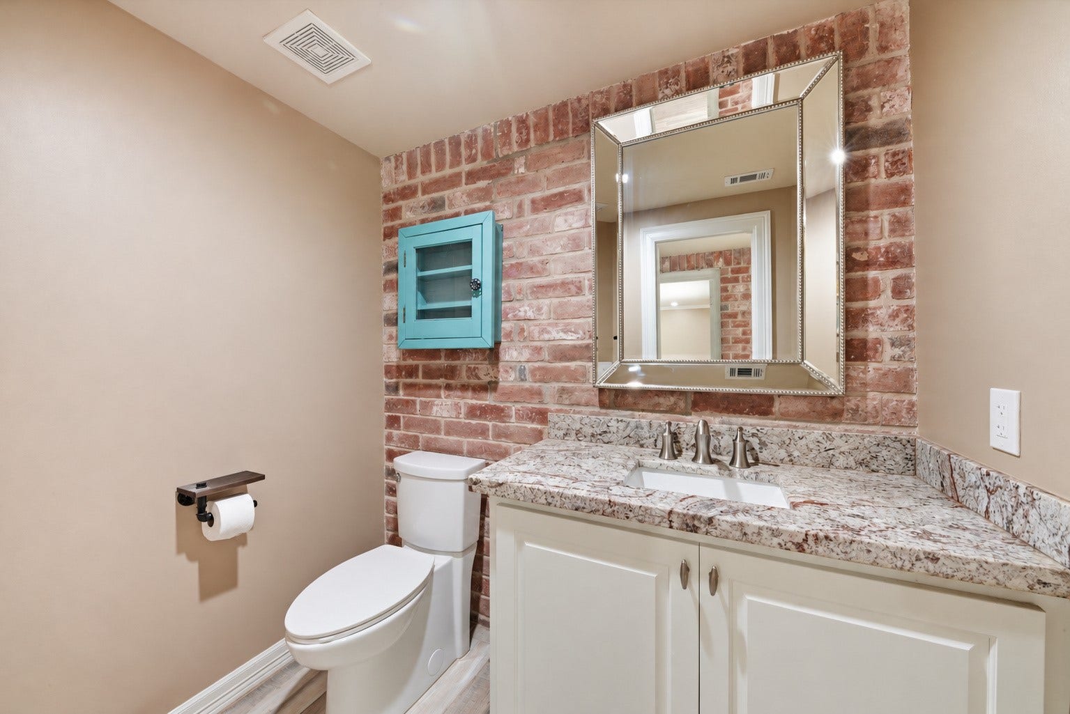 109 Riverbrook Drive, Conroe, TX 77385 Powder bath with access to the flex room and outdoor pool area