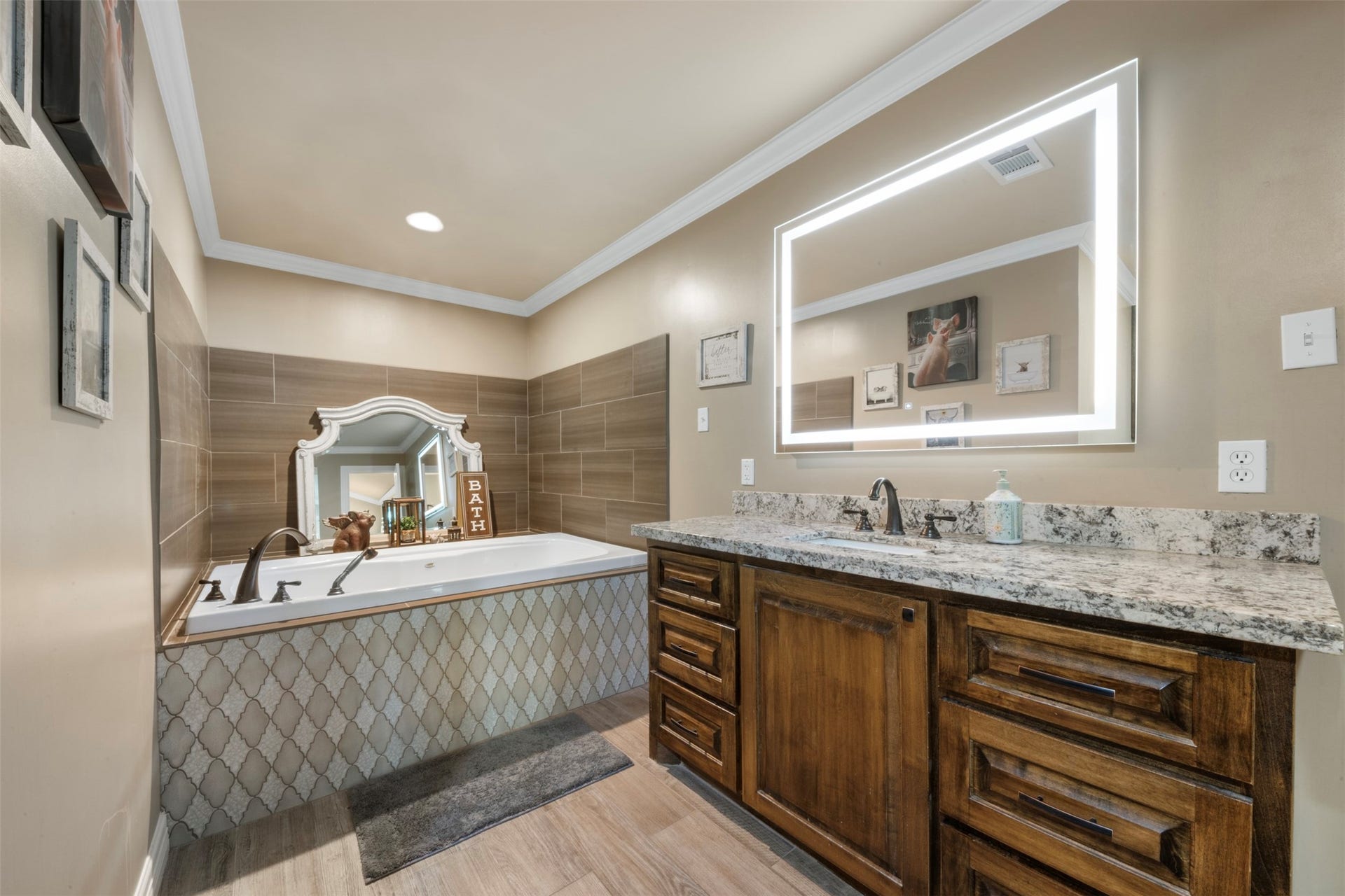 109 Riverbrook Drive, Conroe, TX 77385 Primary full bathroom "Hers" featuring dimmable vanity mirror, and luxury soaking tub